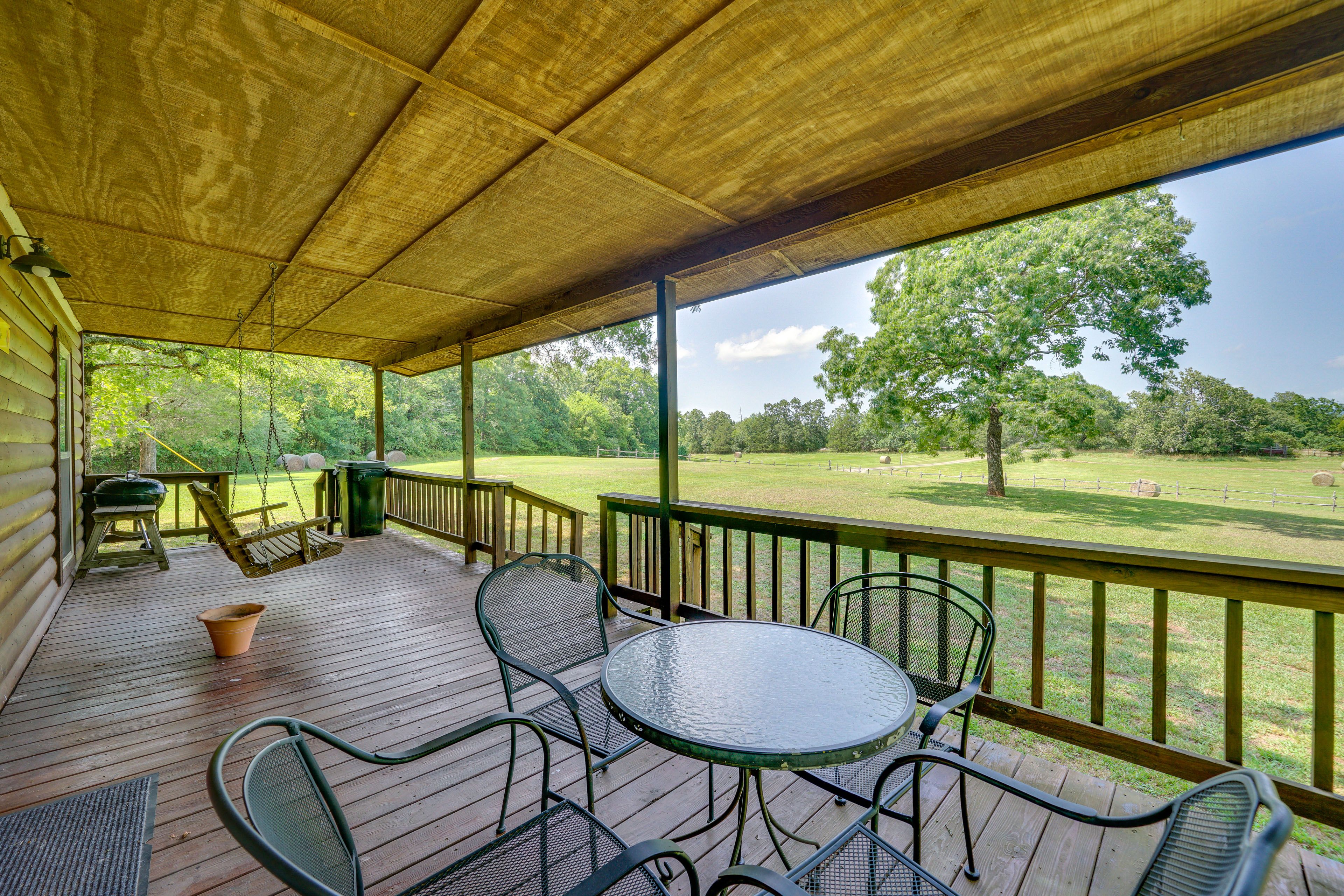Covered Porch | Charcoal Grill | 80 Acres | 2-Story Cabin