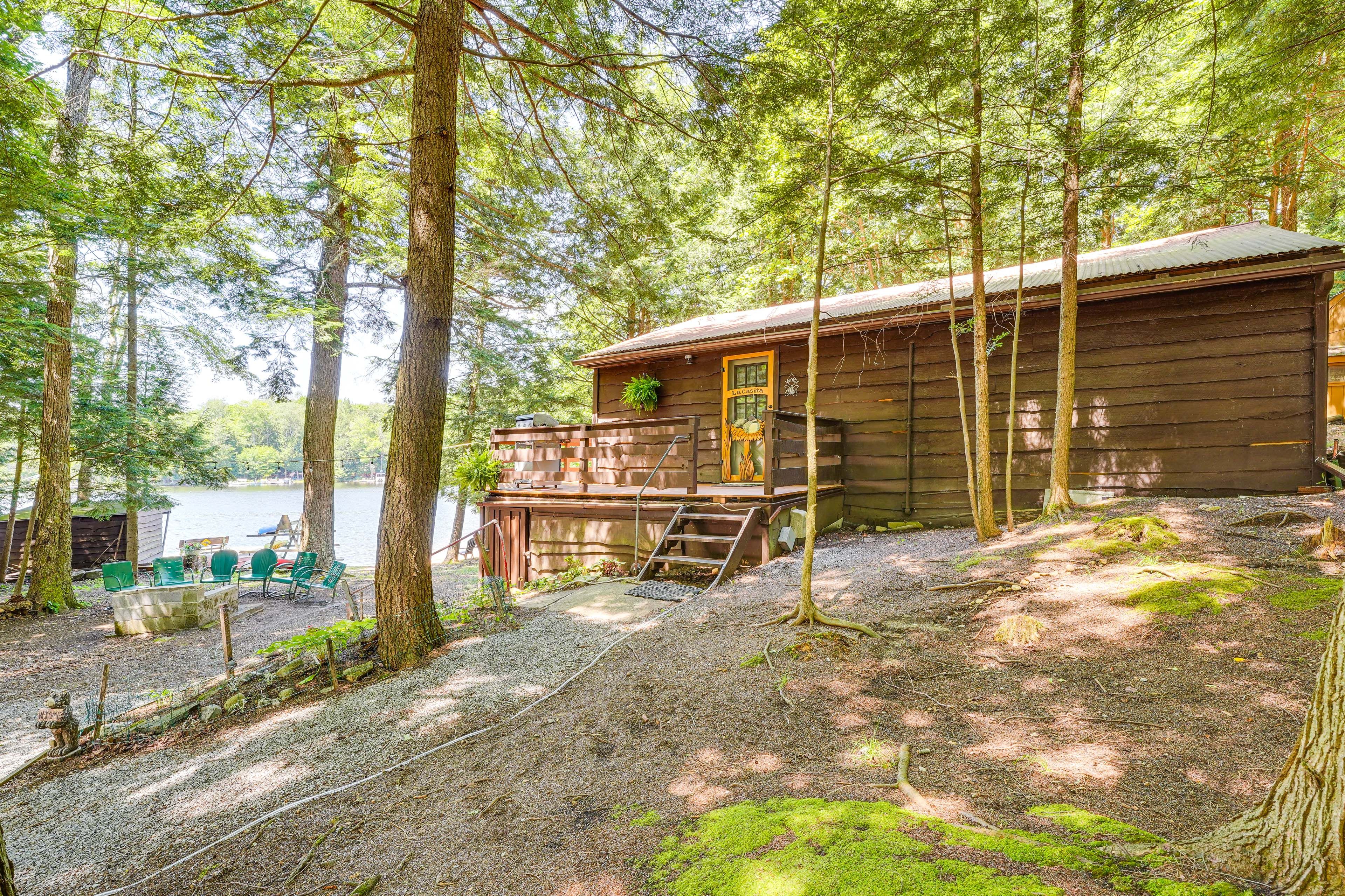Cabin Exterior | Private Beach & Lake Access | Outdoor Fireplace