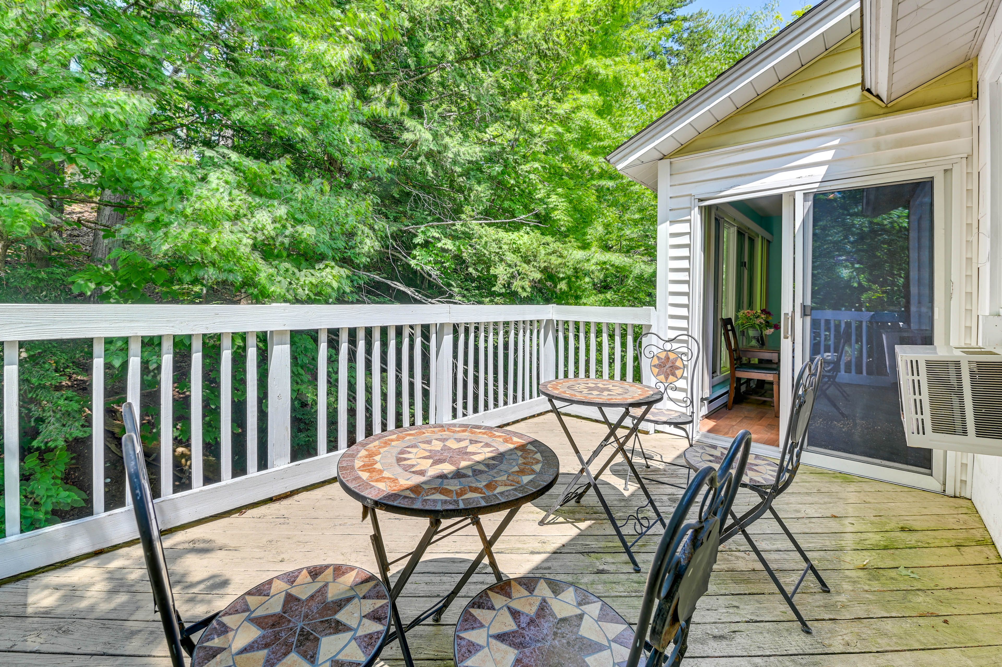 Private Deck | Outdoor Dining Area | Partial Lake Views