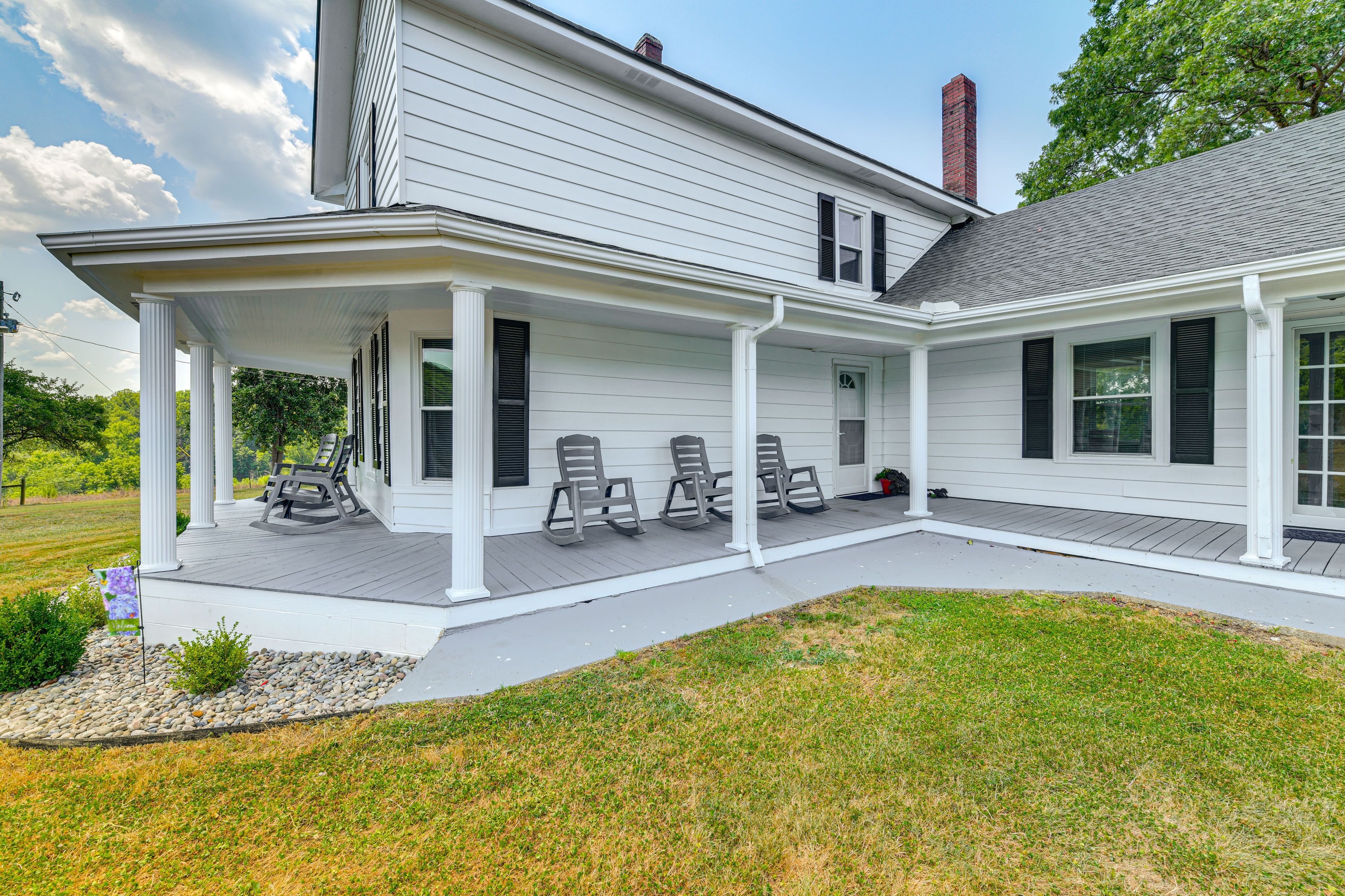 House Exterior | Wraparound Porch | Rocking Chairs
