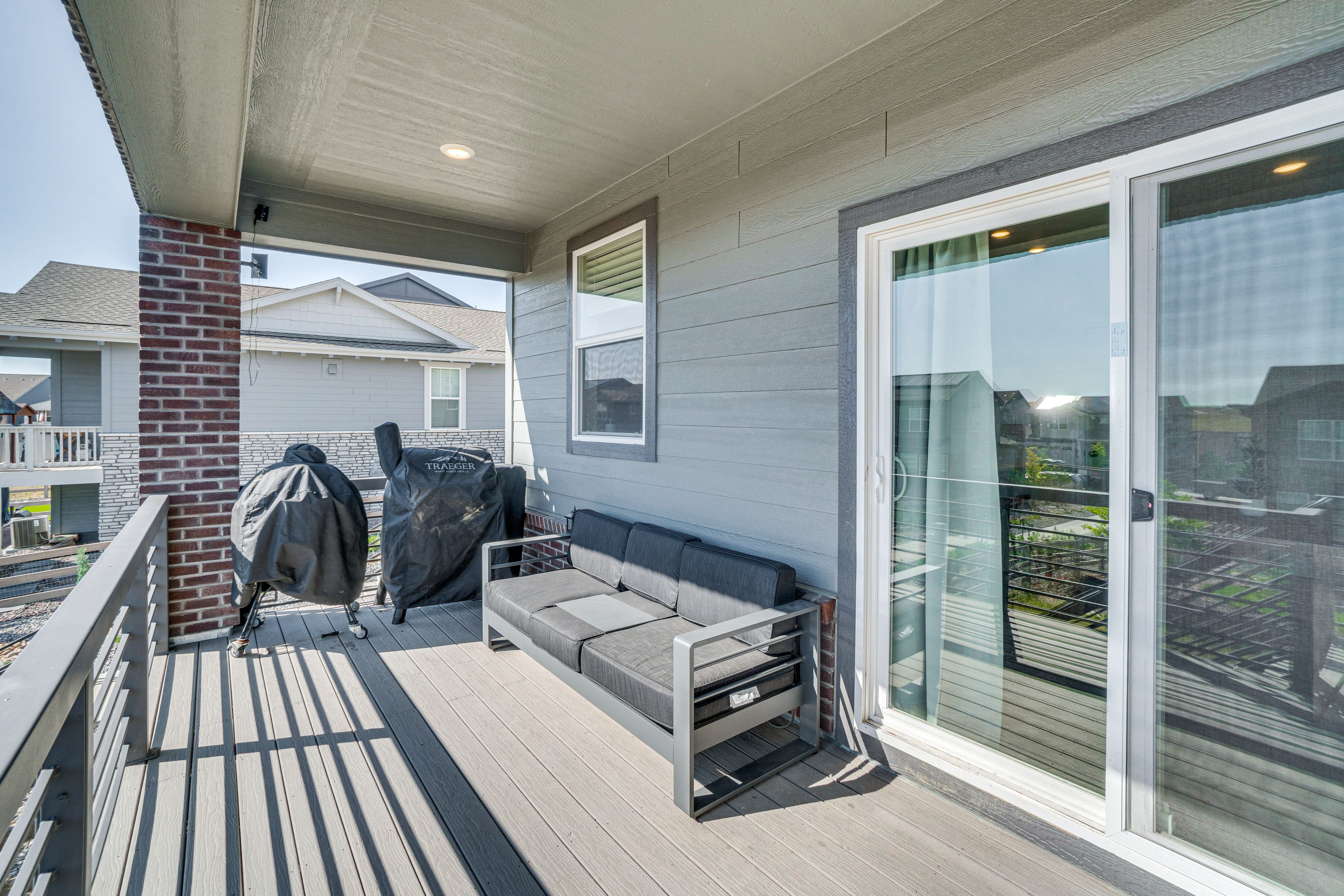 House Exterior | Furnished Balcony | Gas & Charcoal Grills