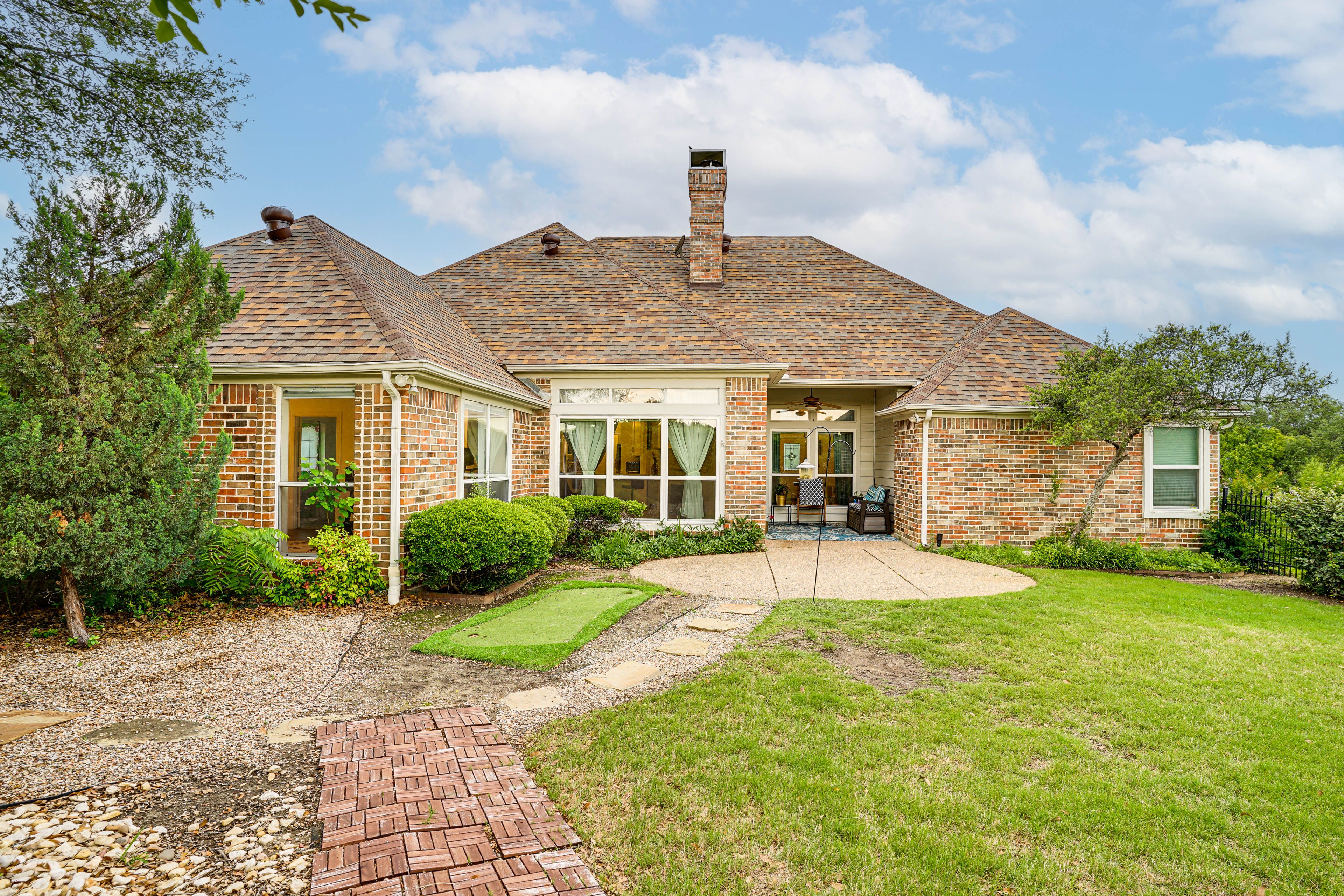 Back Exterior | Patio | Putting Green | Spacious Yard