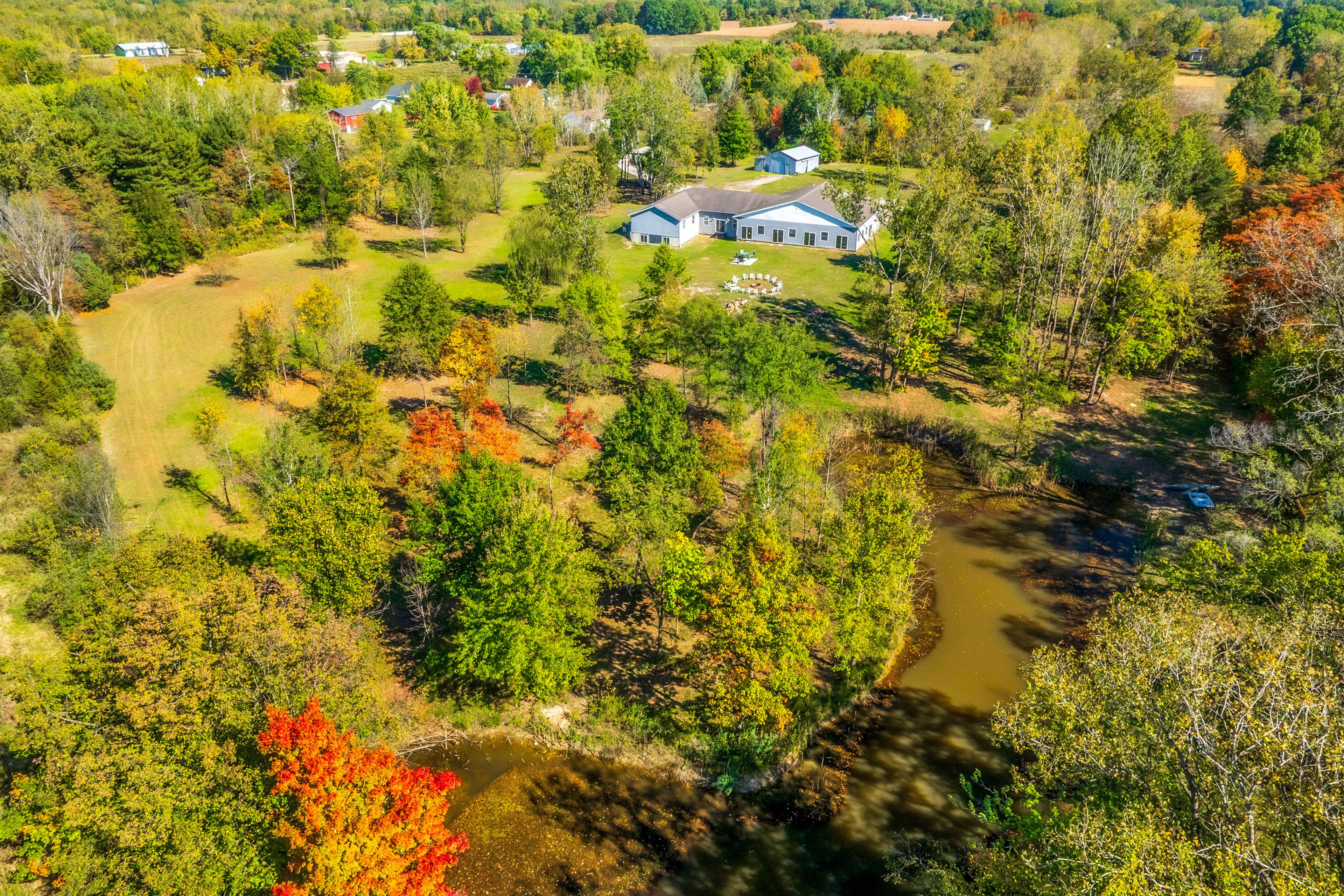 Aerial View | On-Site Pond | Spacious Yard