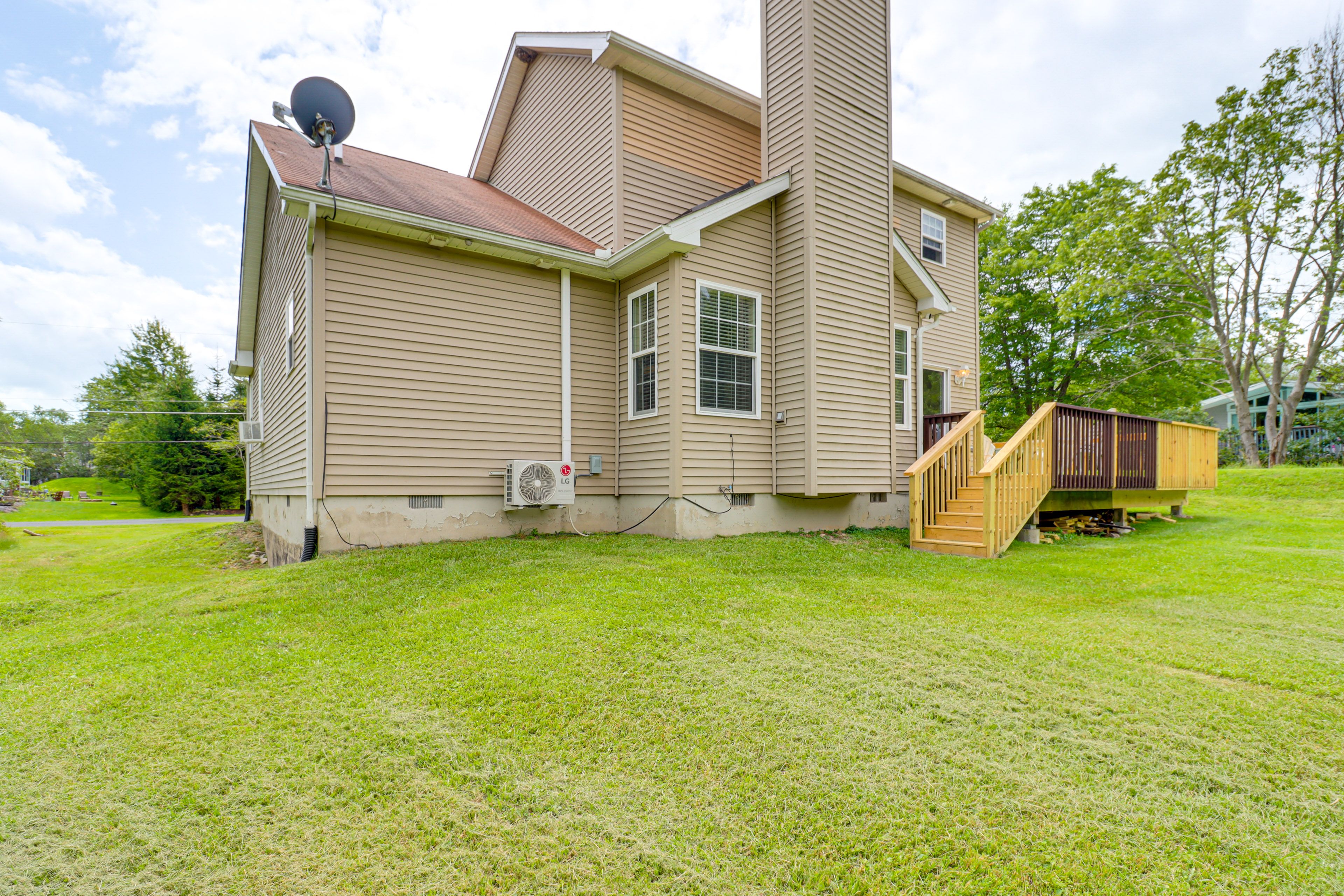 Property Exterior | Deck w/ Seating & Grill | Spacious Yard