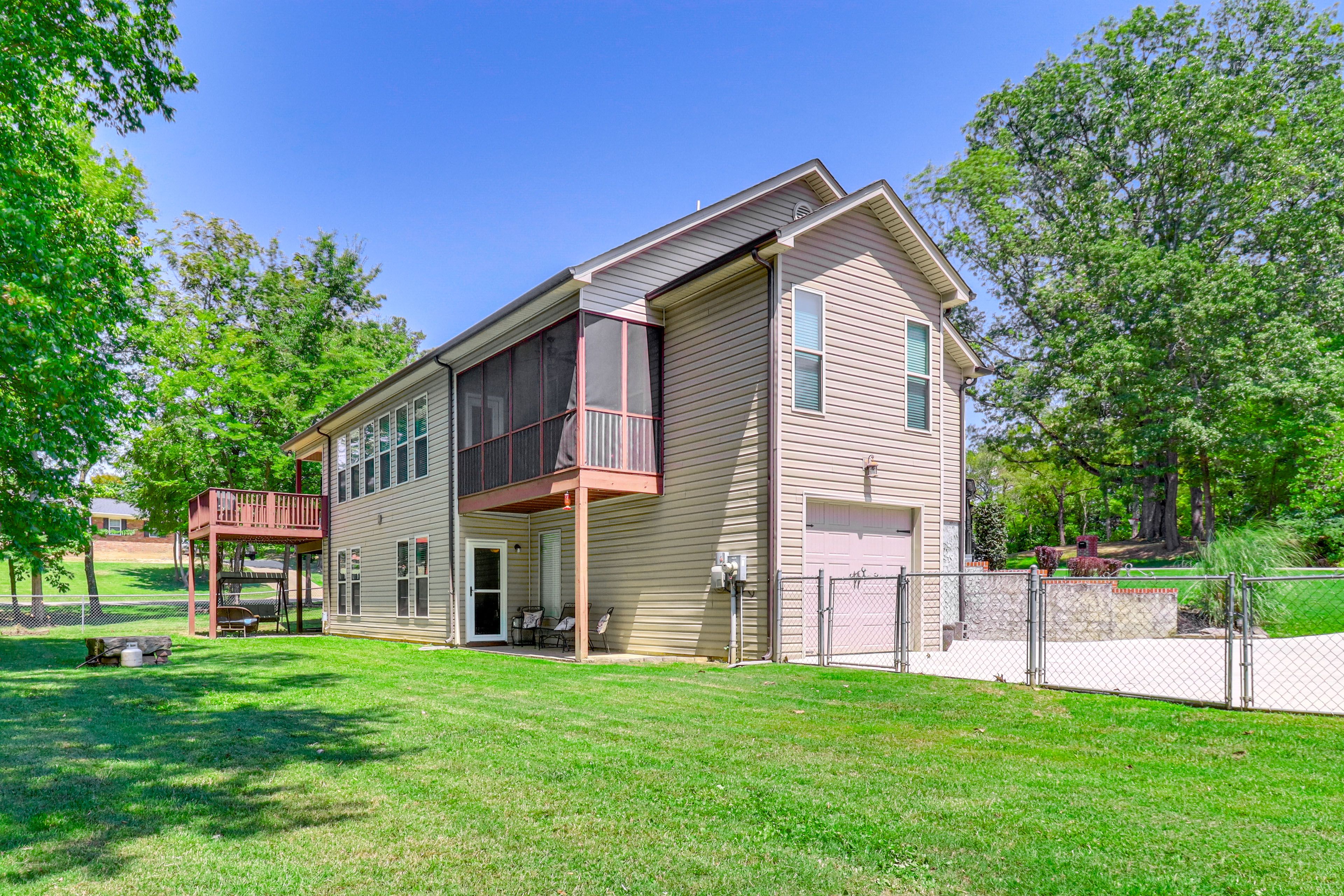 Condo Exterior | Lower-Level Unit | Yard | Patio | Fire Pit