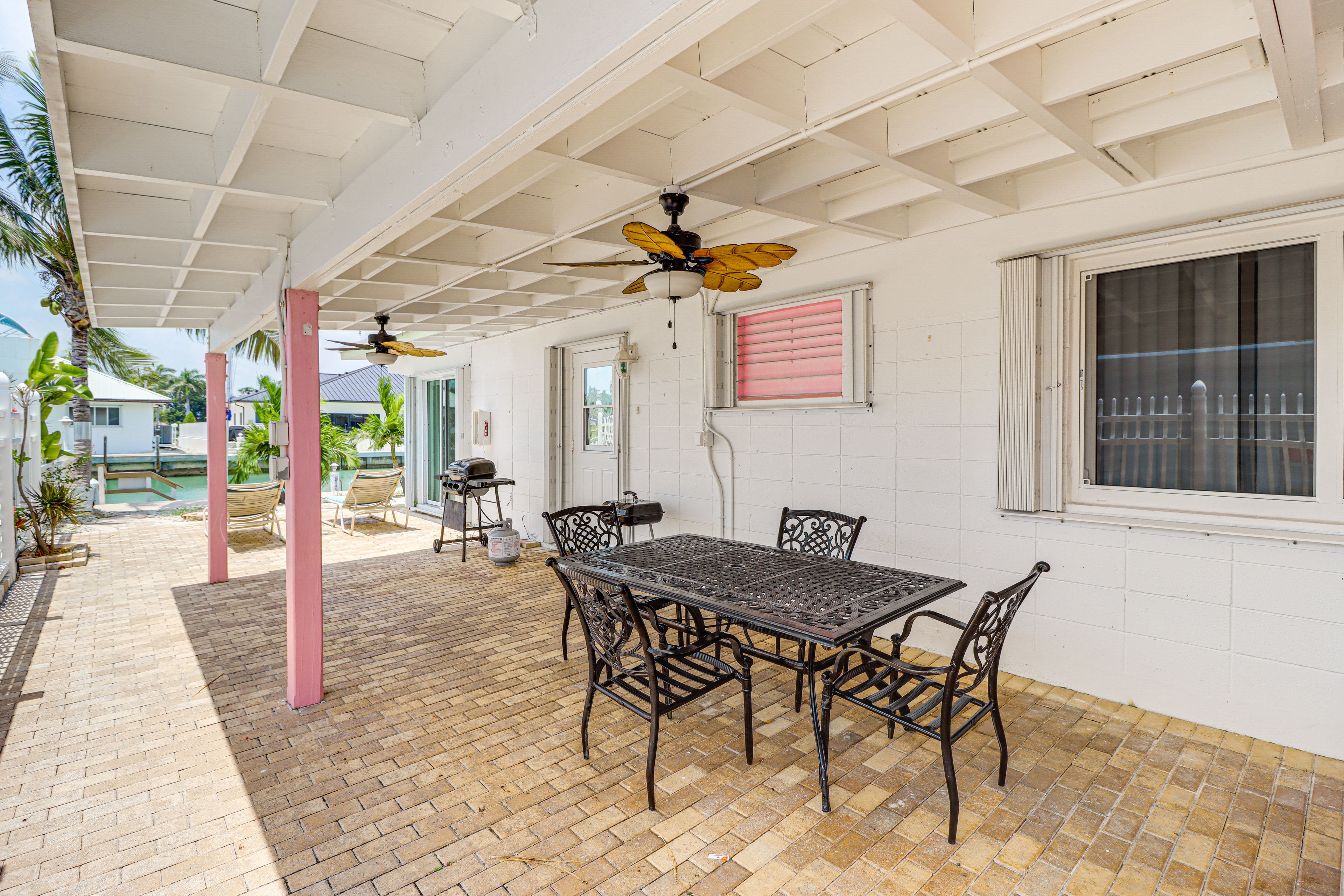 Covered Patio | Gas Grill | Outdoor Dining Area | Canal Access
