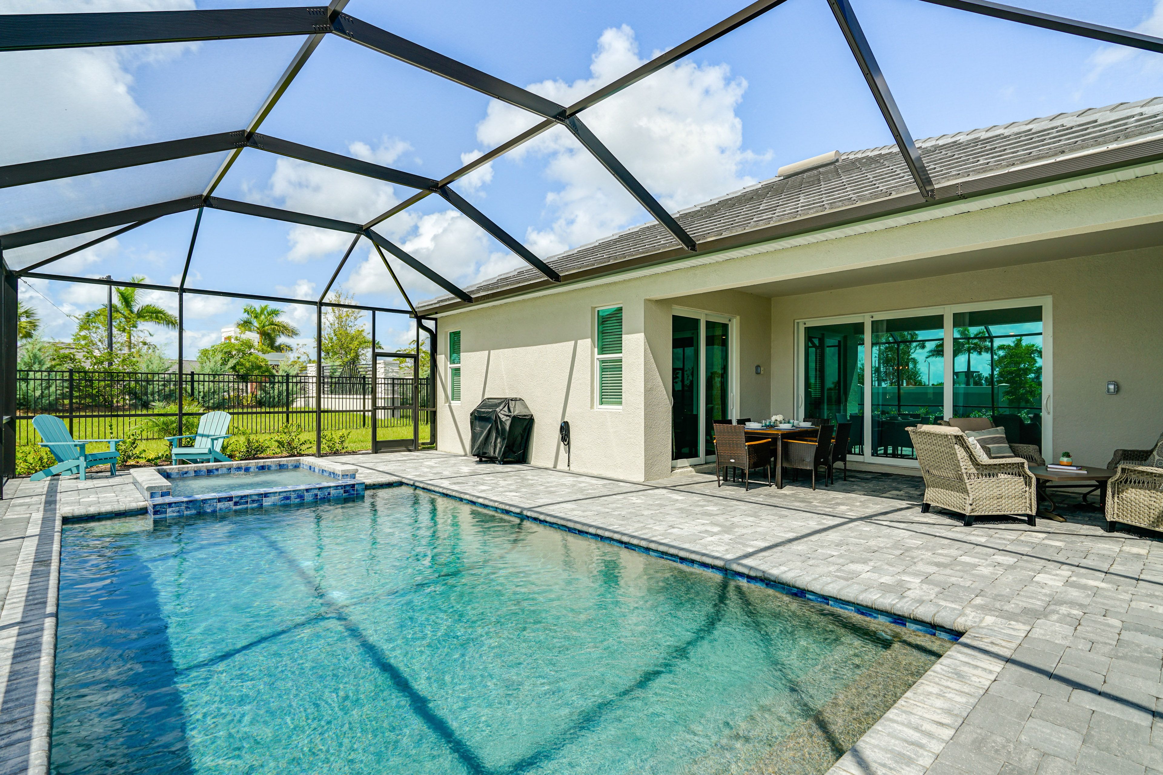 Screened-In Lanai | Outdoor Pool & Hot Tub | Gas Grill
