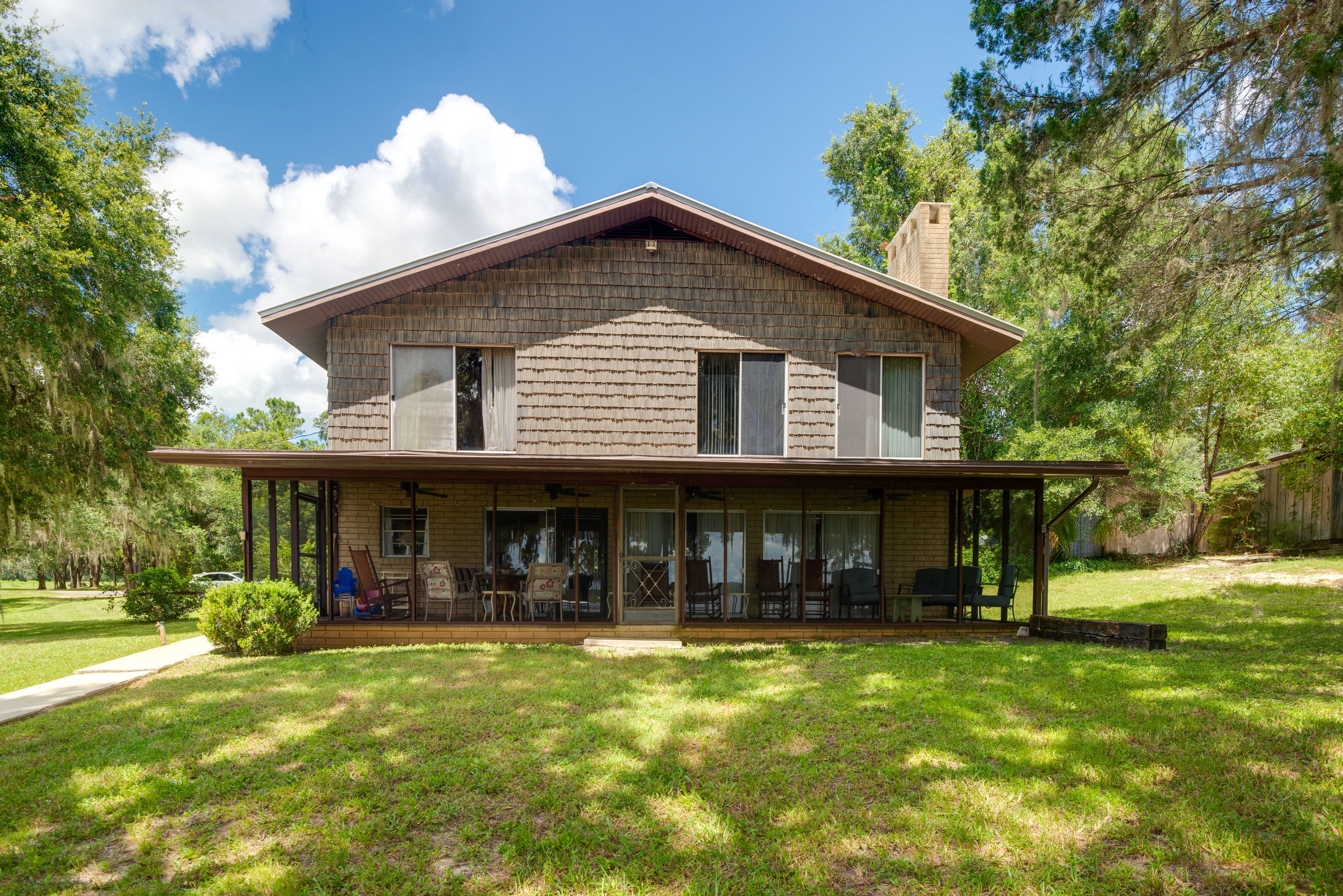 Property Exterior | Screened-In Porch | Spacious Yard