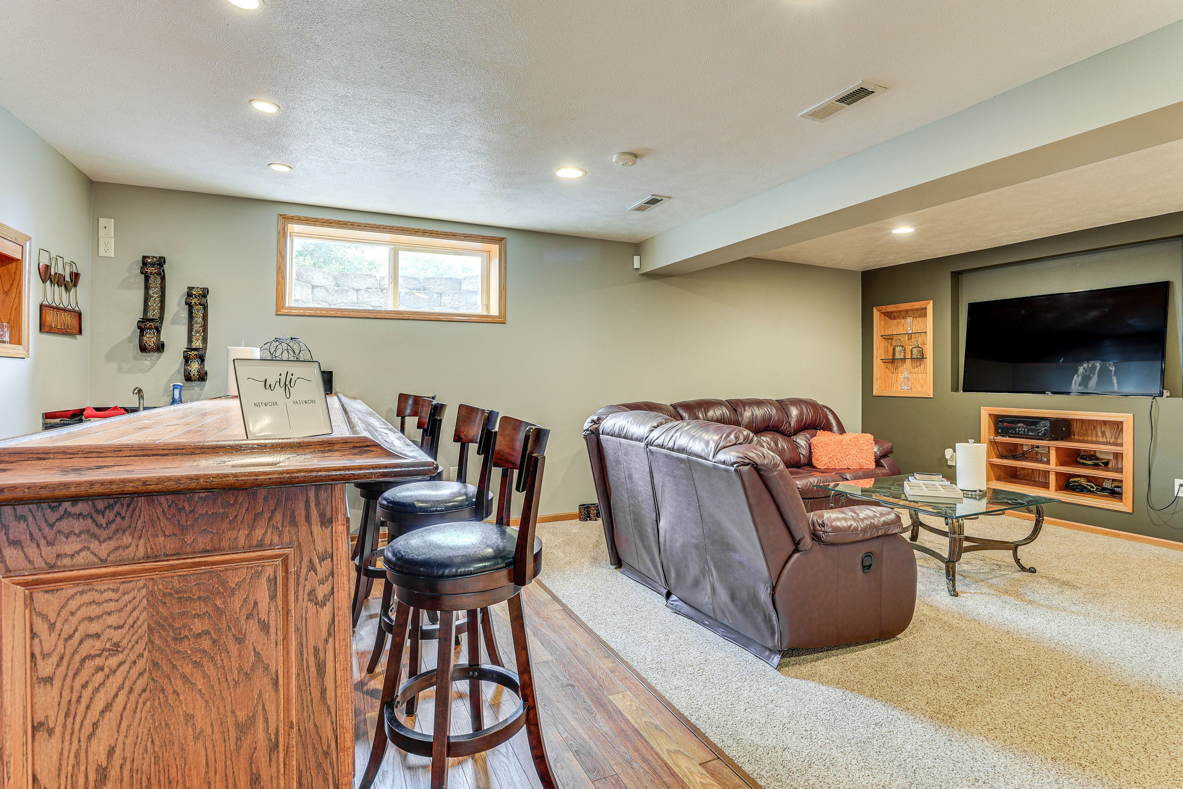 Den | Lower Level | Piano | 65" Smart TV | Keurig Coffee Maker