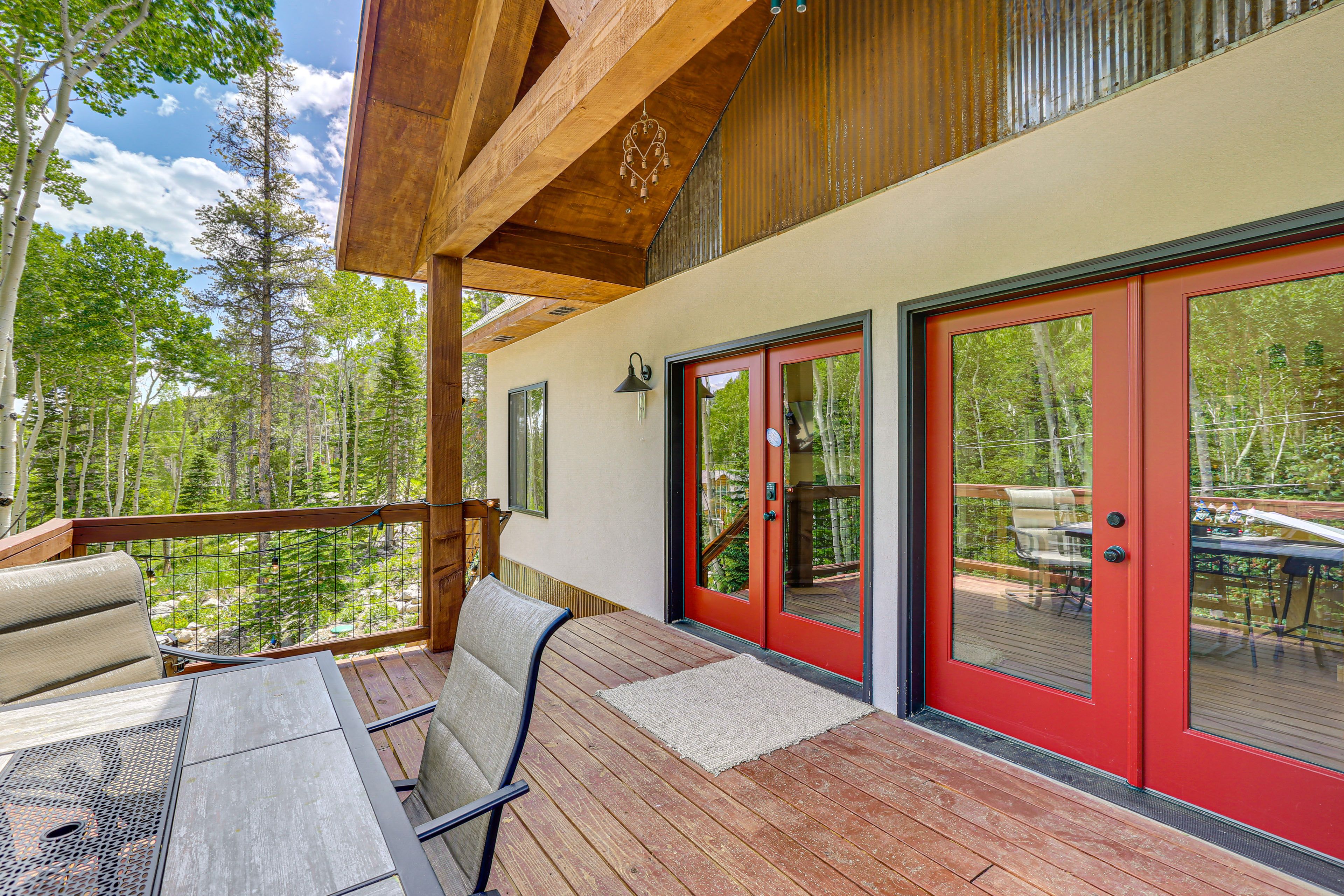 House Exterior | Deck w/ Dining Area | Charcoal Grill/Smoker