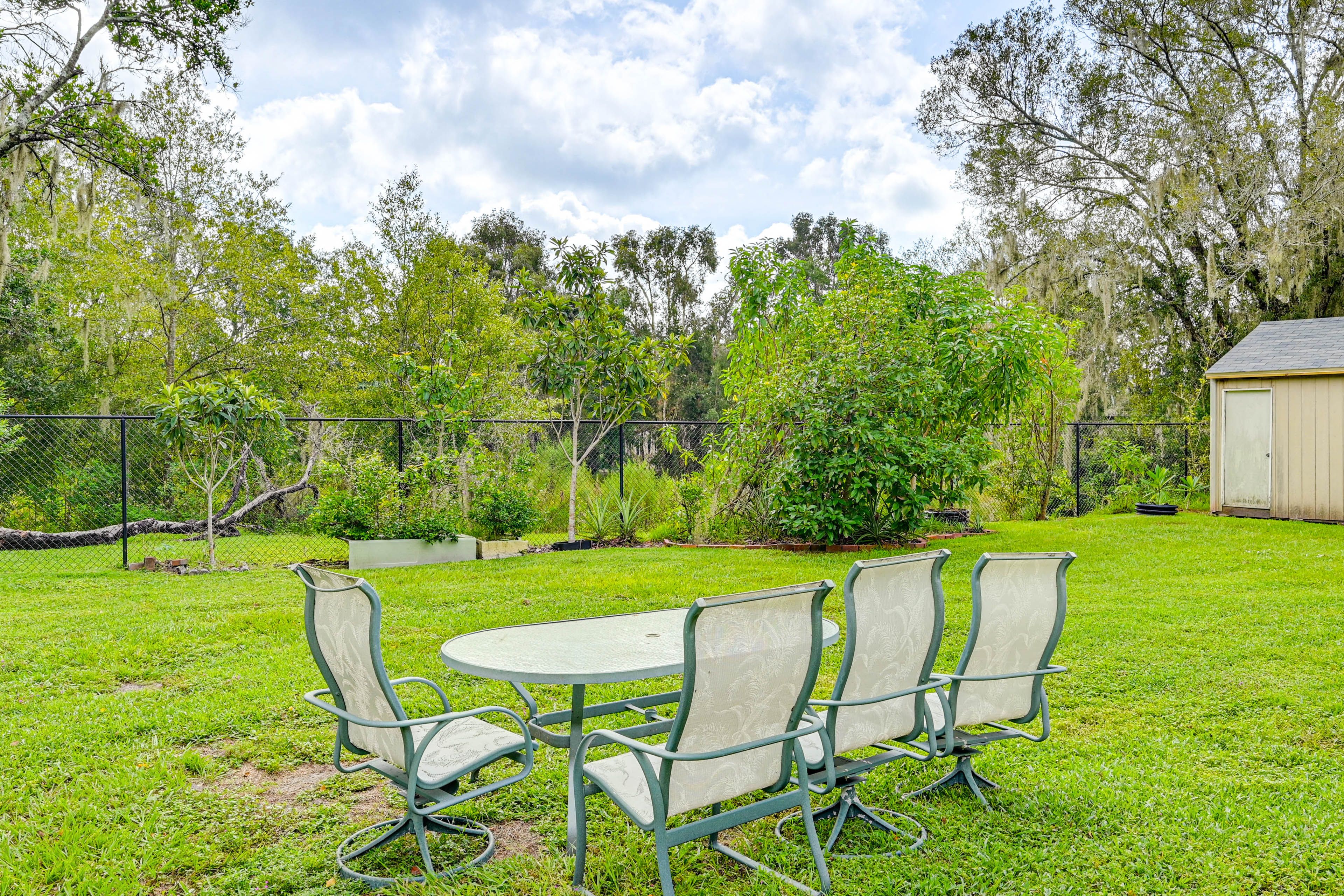 Fenced-In Backyard | Dining Area | Charcoal Grill