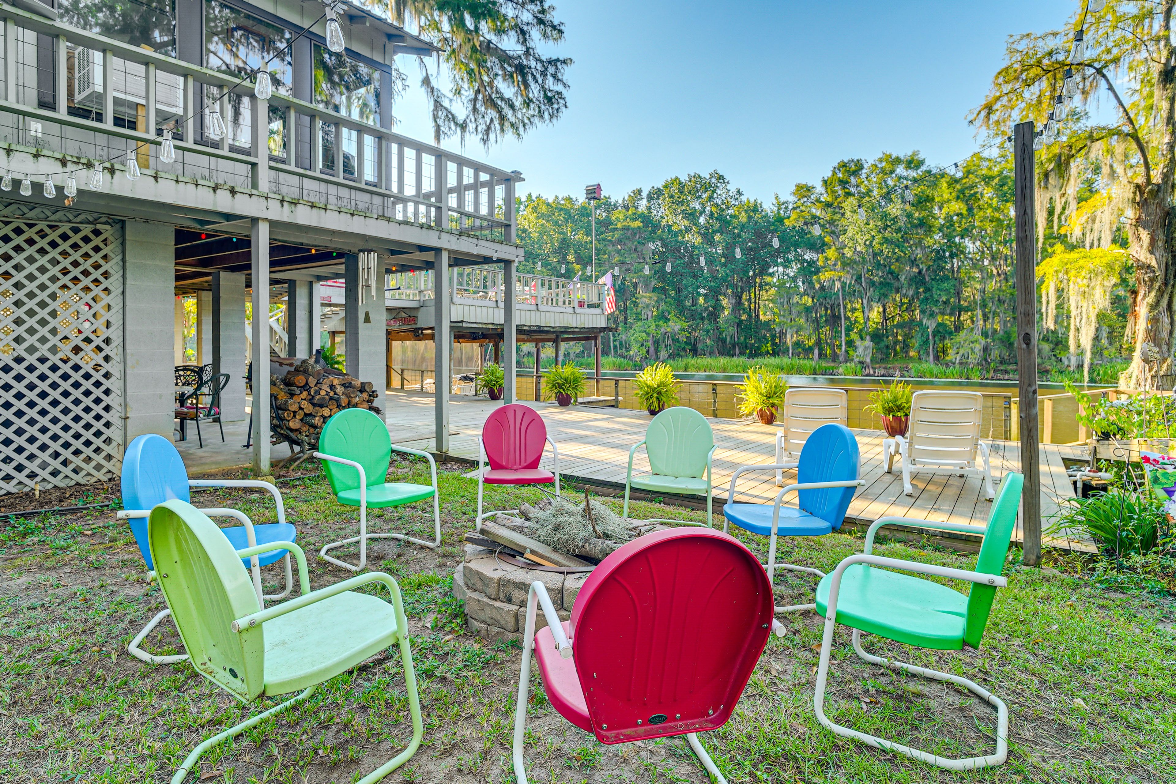 Partially Fenced-In Yard | Fire Pit | Caddo Lake Access & Views