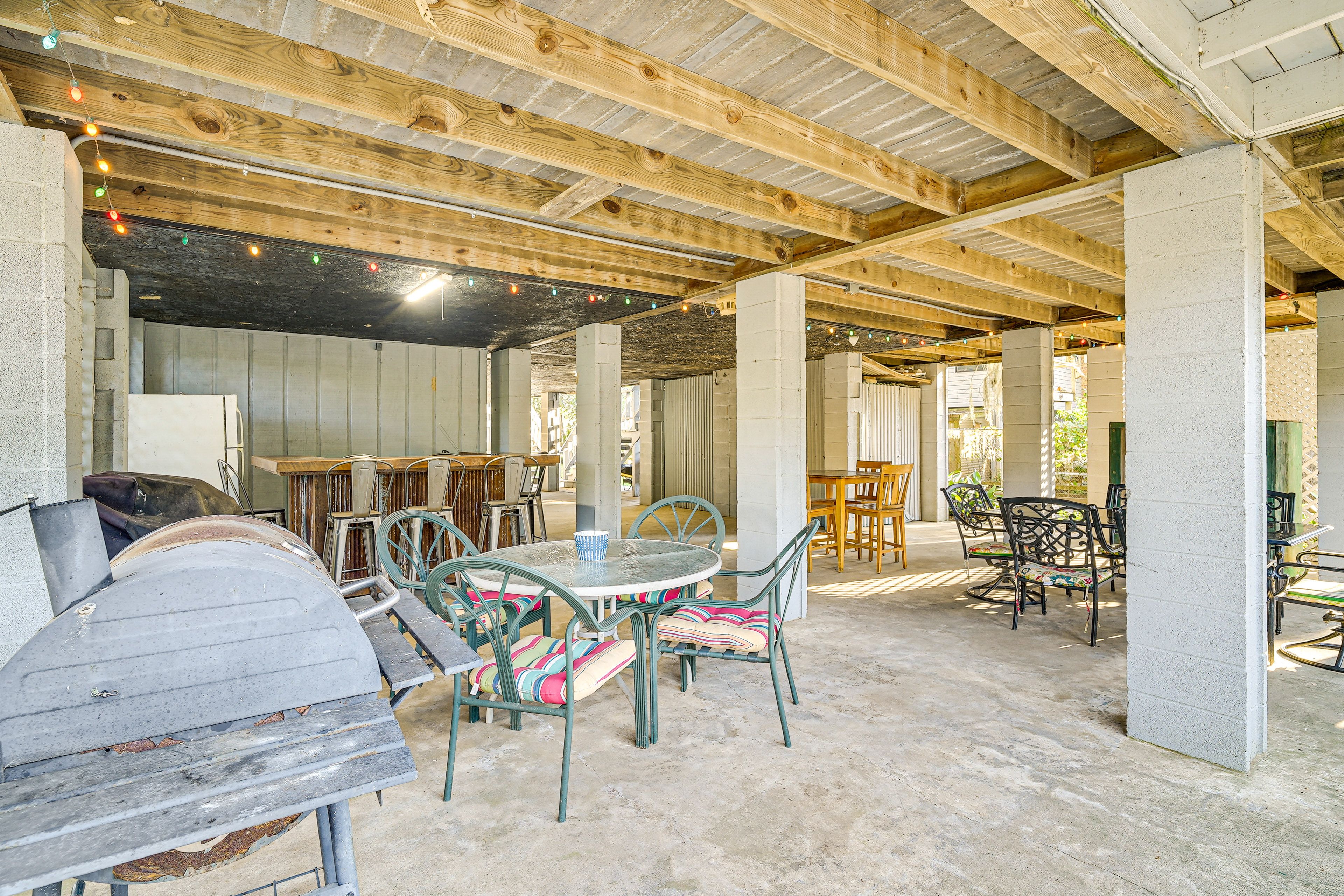Covered Patio | Outdoor Dining Area w/ Bar Seating & Refrigerator