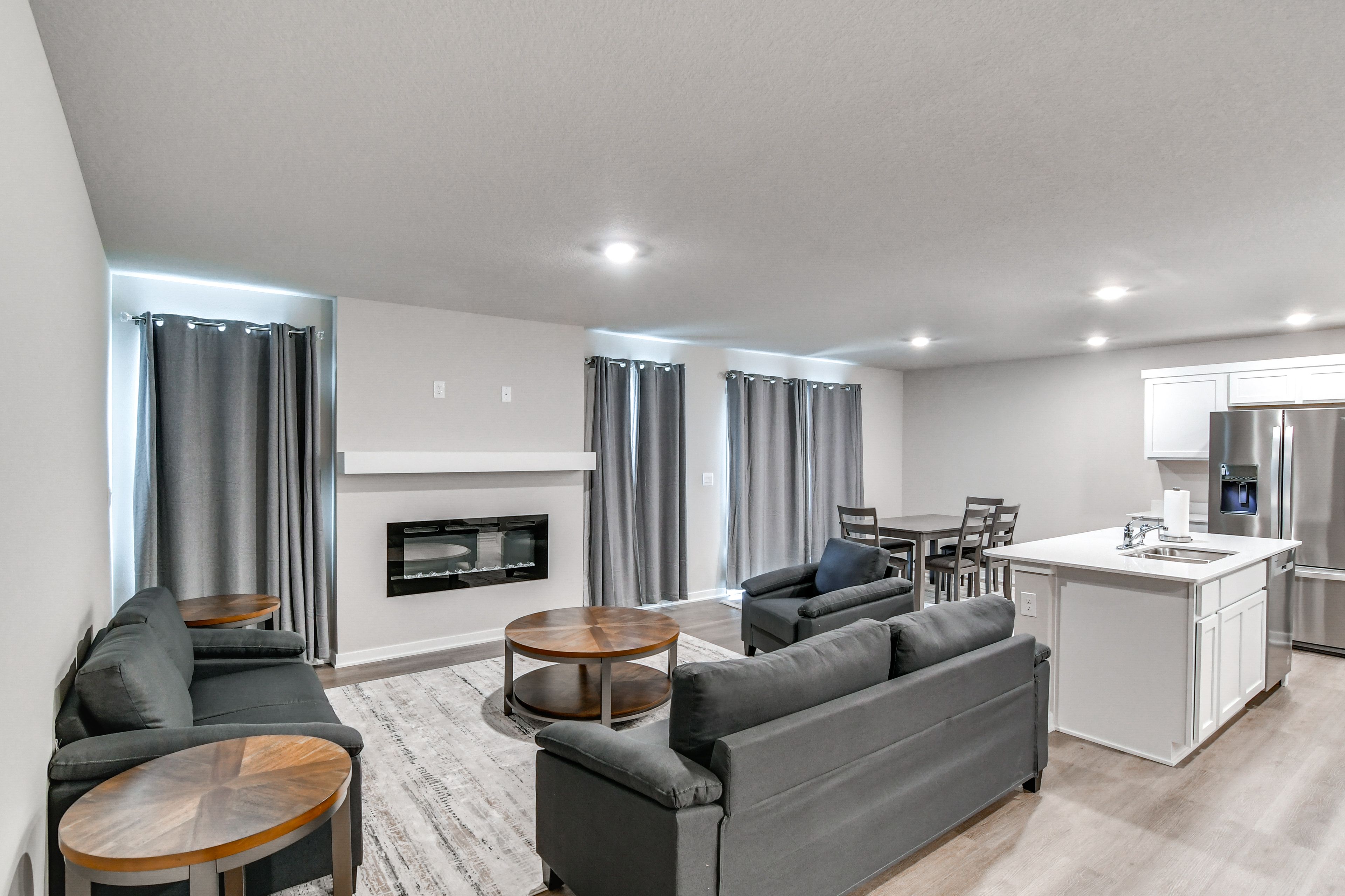 Living Room | 1st Floor | Gas Fireplace | Dining Table | Dishware/Flatware