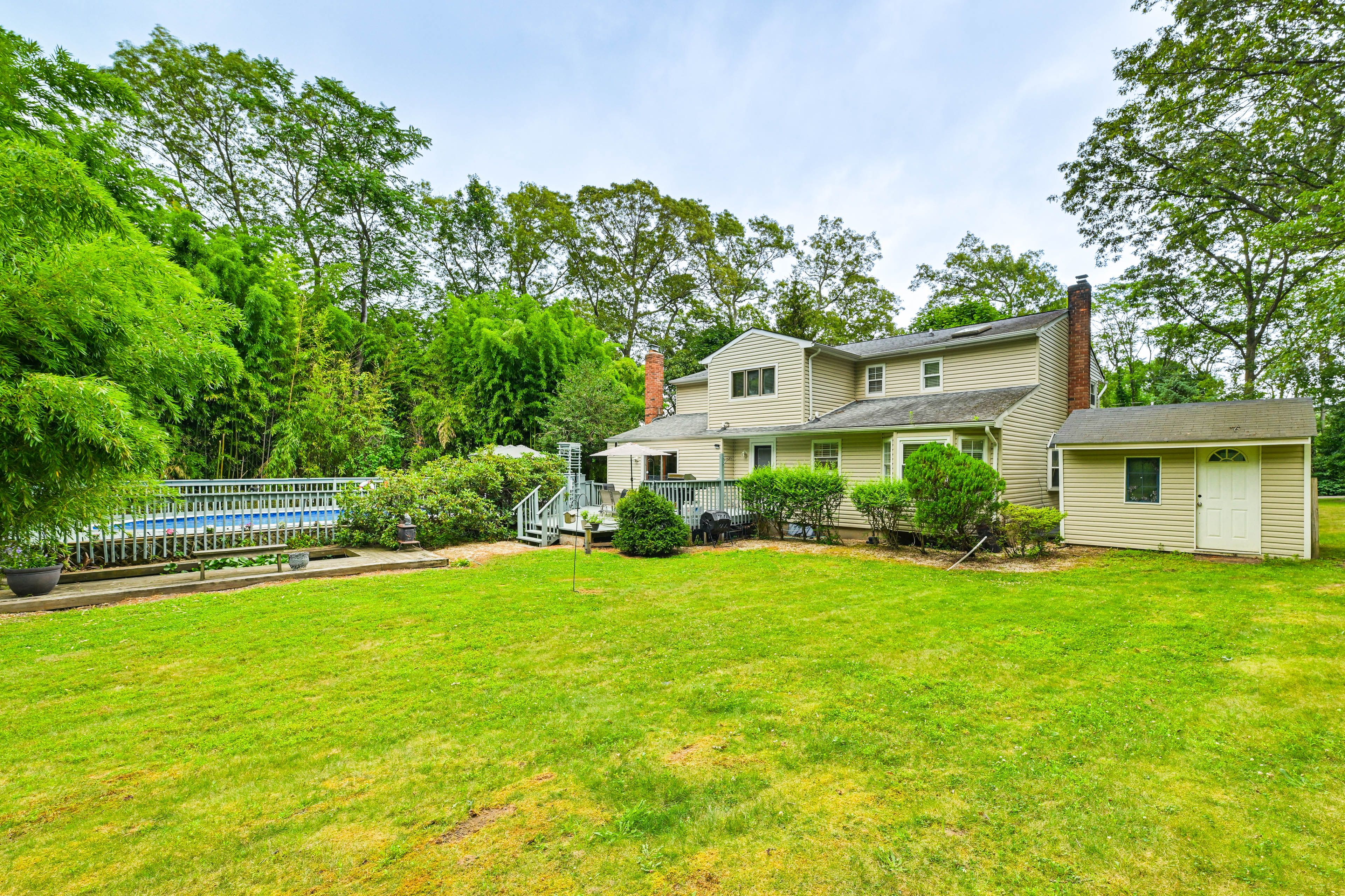 Exterior | 2-Story Home | Spacious Backyard | Furnished Deck