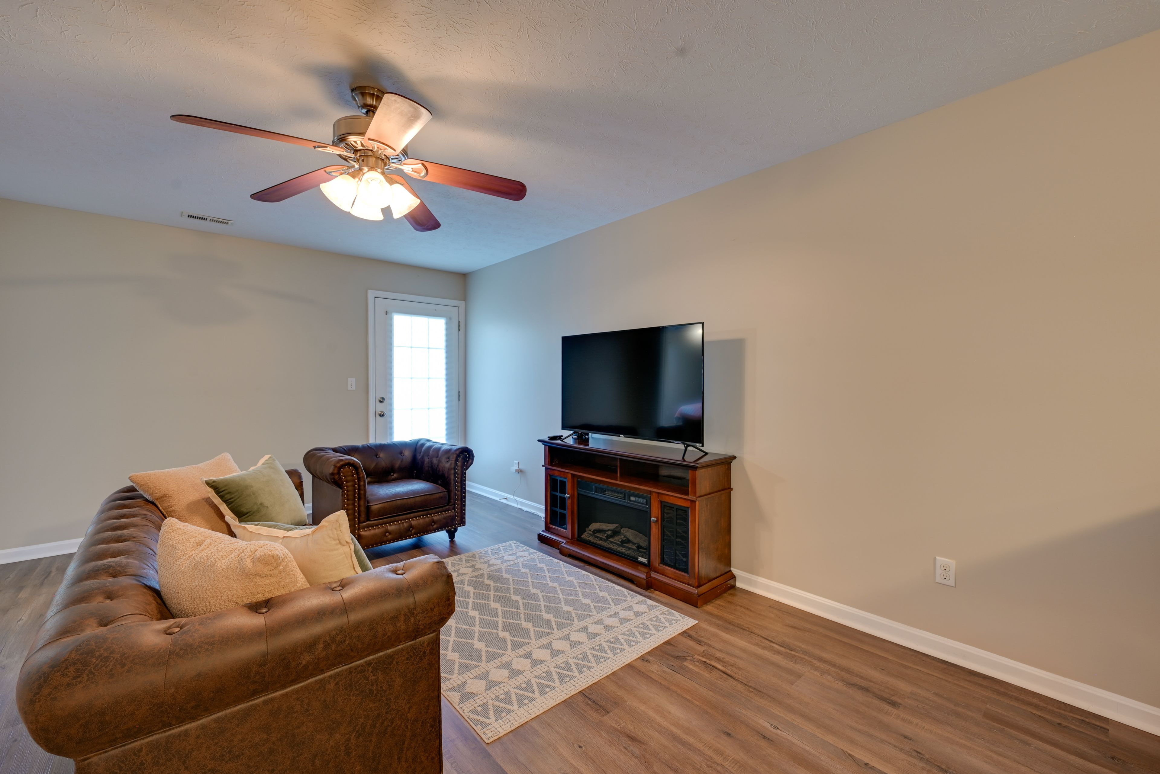 Living Room | Smart TV | Electric Fireplace | Single-Story Unit