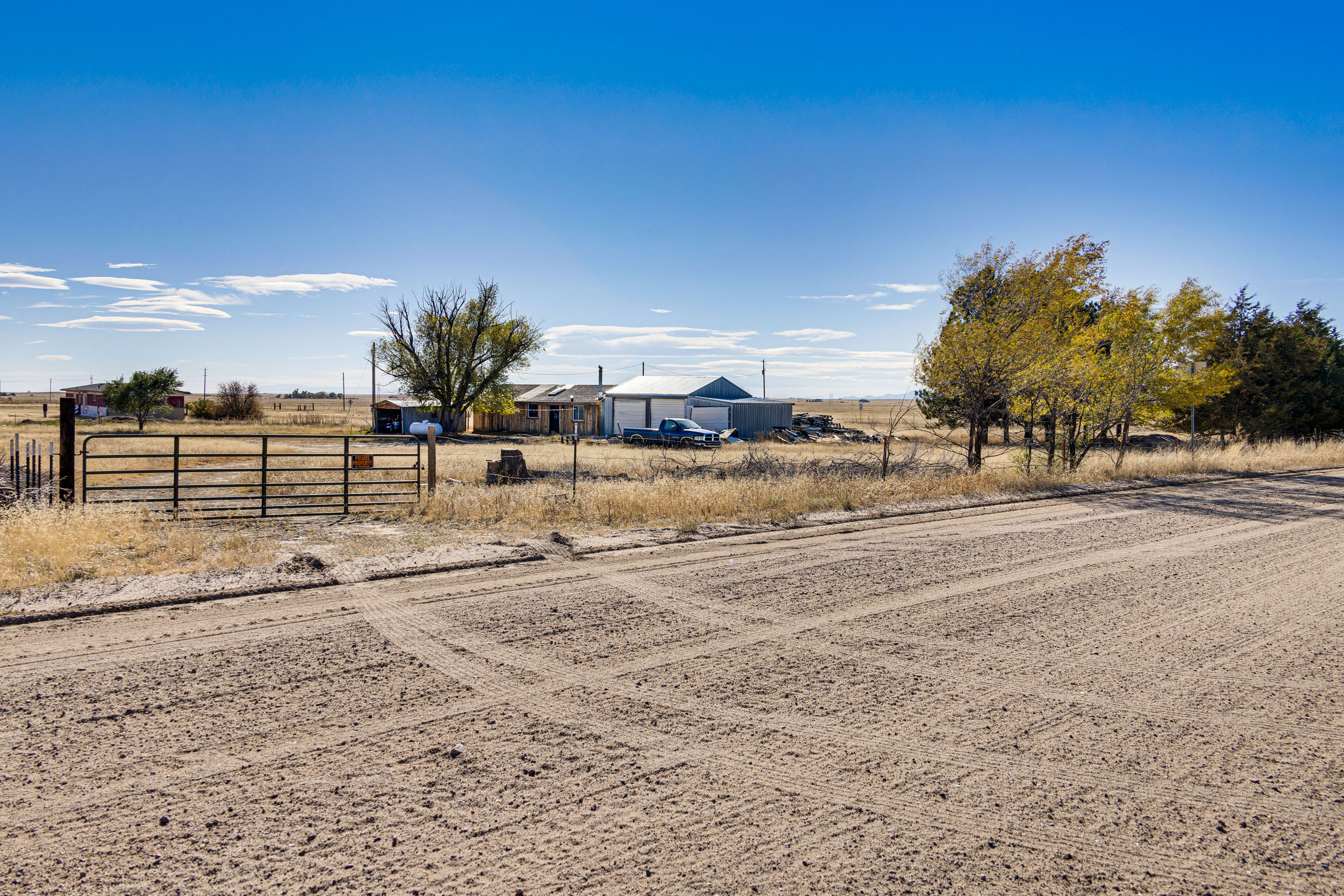 Parking | Gated Dirt Driveway (2 Vehicles) | RV Parking Allowed On-Site