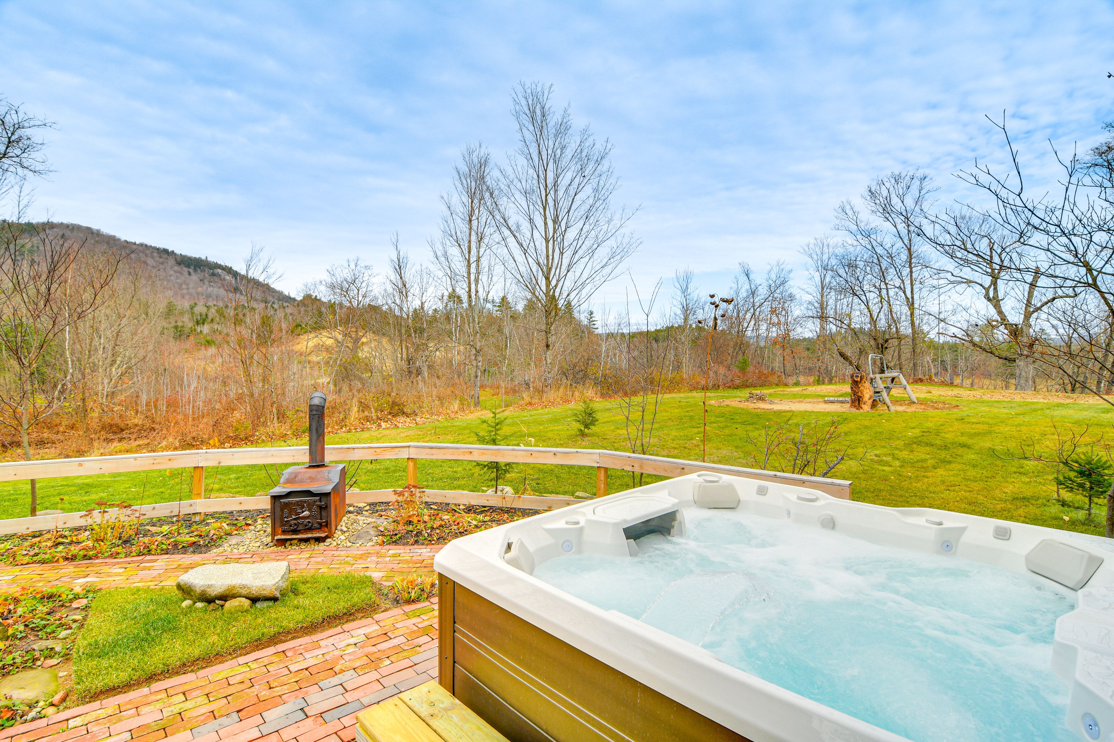 Hot Tub | Spacious Deck & Backyard | Mountain Views