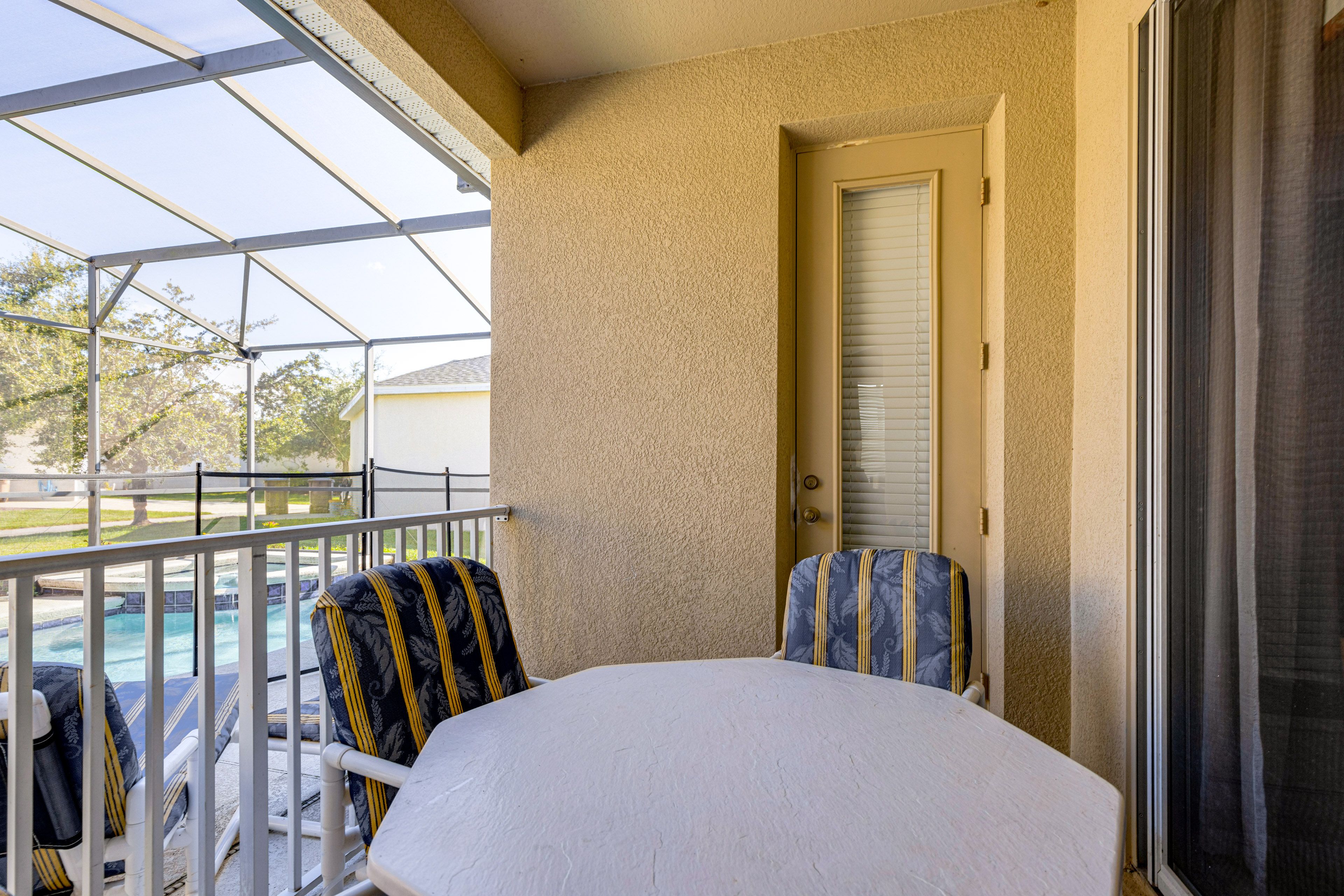 Screened-In Lanai | Dining Area | Gas Grill | Lounge Chairs