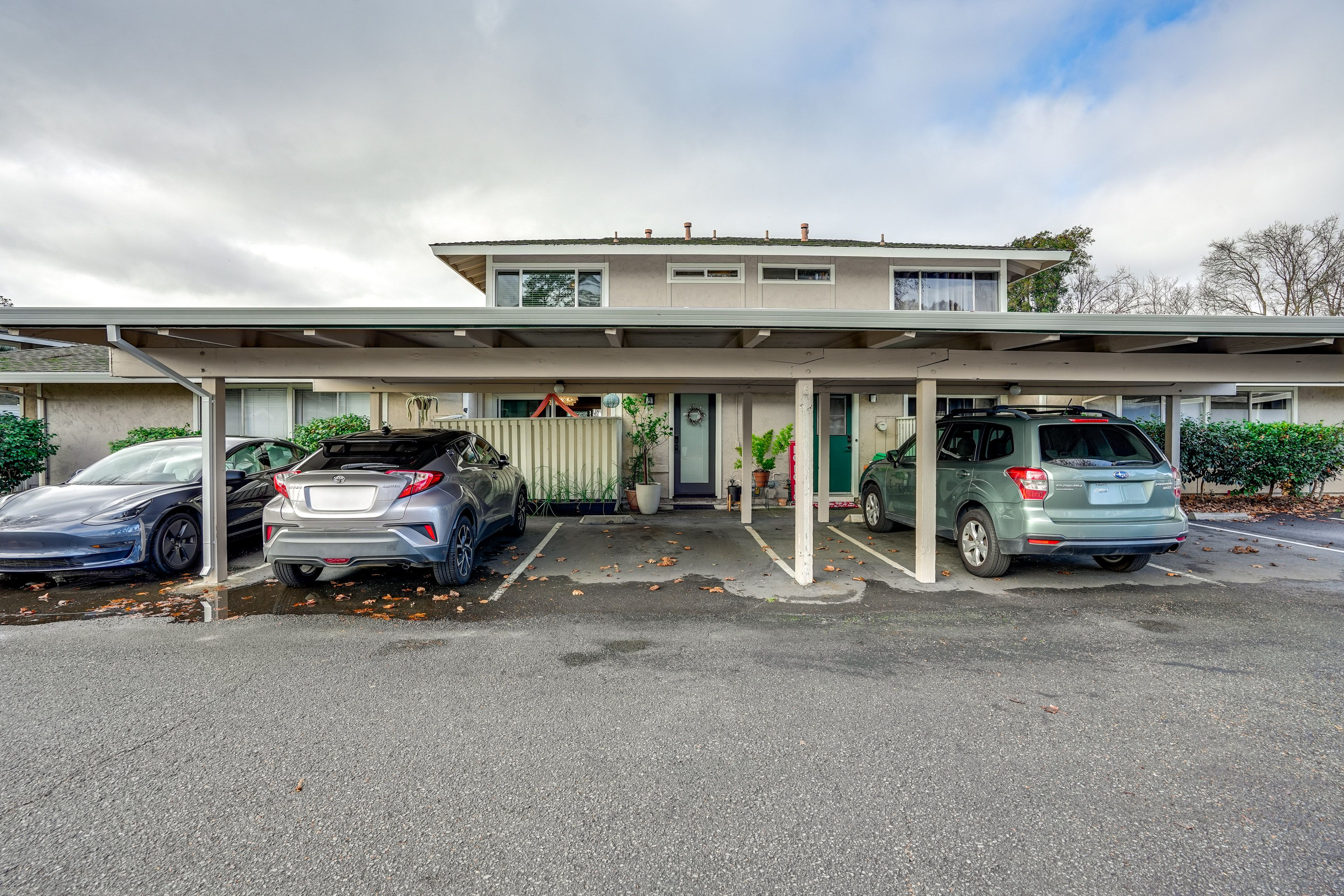 Townhome Exterior | Parking | Carport (1 Vehicle) | Designated Spot (1 Vehicle)