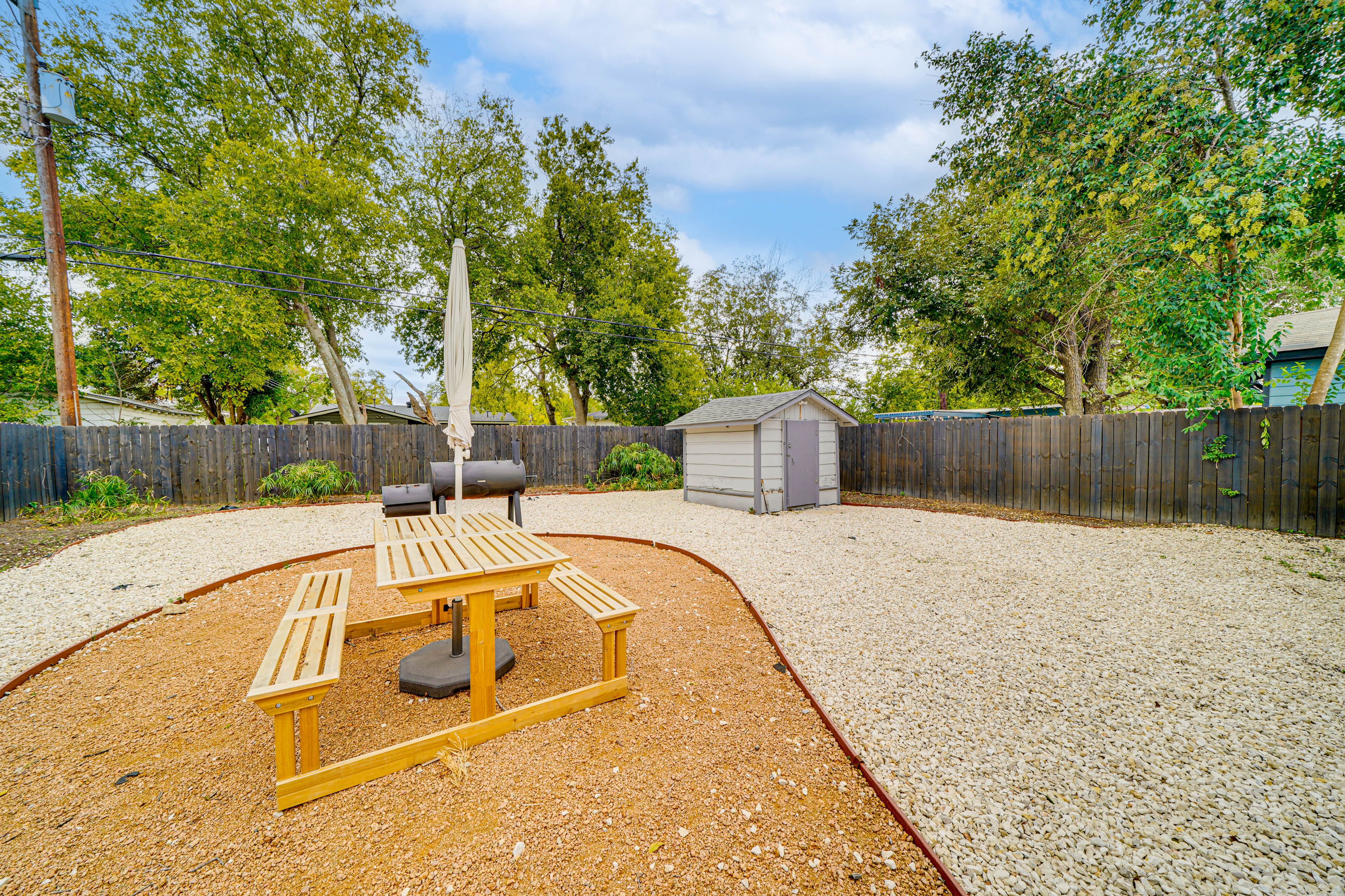 Fenced Backyard | Outdoor Dining Set | Charcoal Grill