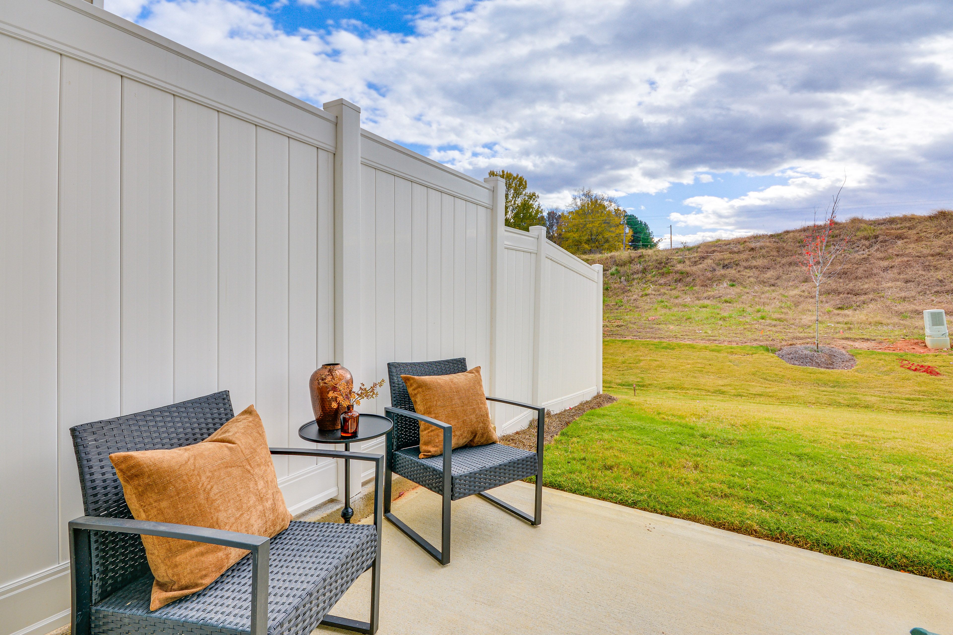 Partially Fenced Backyard | Patio w/ Seating | 2-Story Townhome