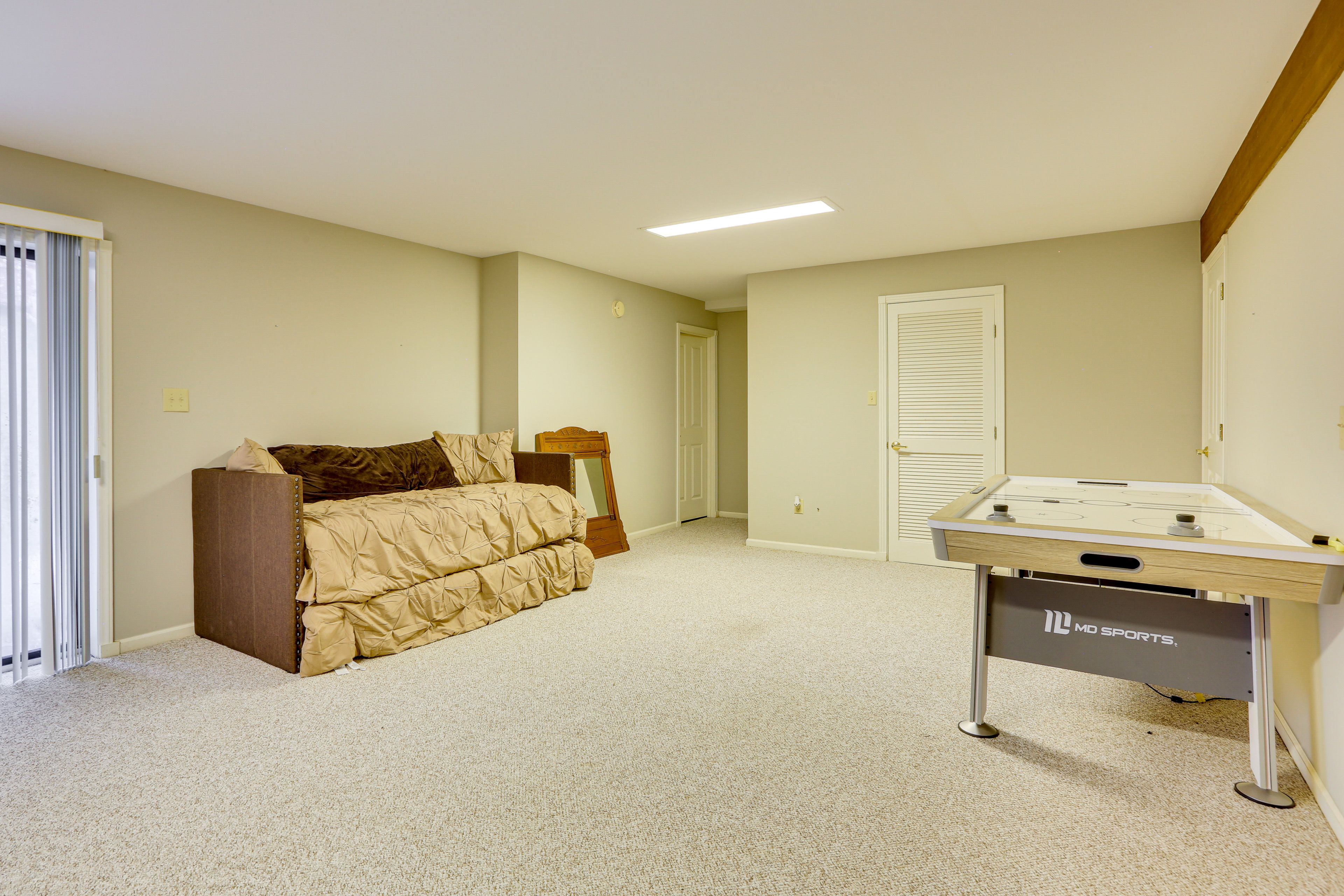 Den | Basement Level | Twin Daybed w/ Twin Trundle | Air Hockey Table