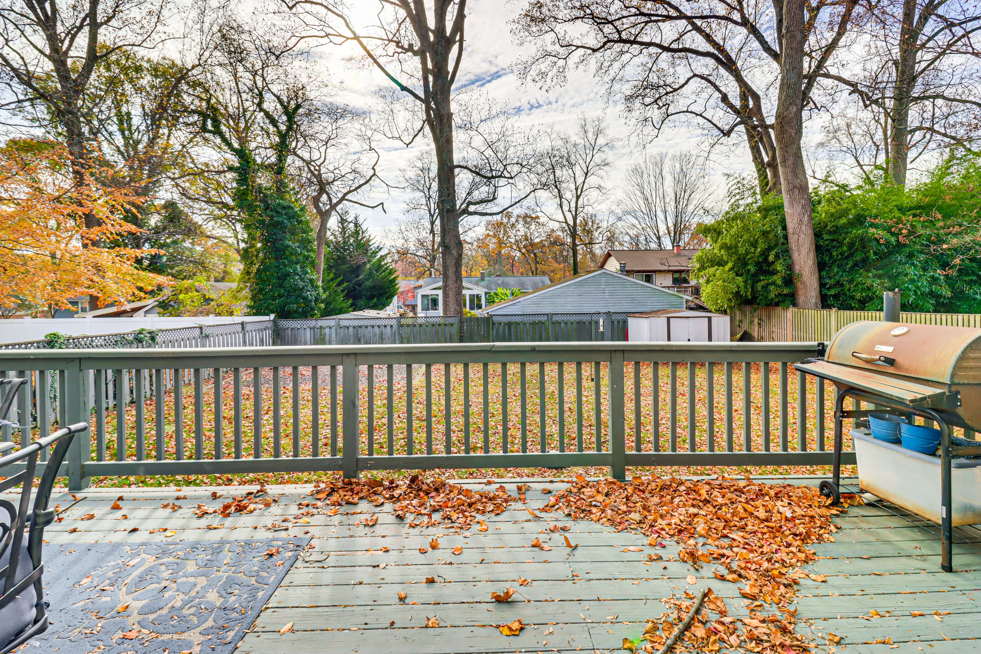 Back Deck | Dining Area | Charcoal Grill | Fenced-In Backyard