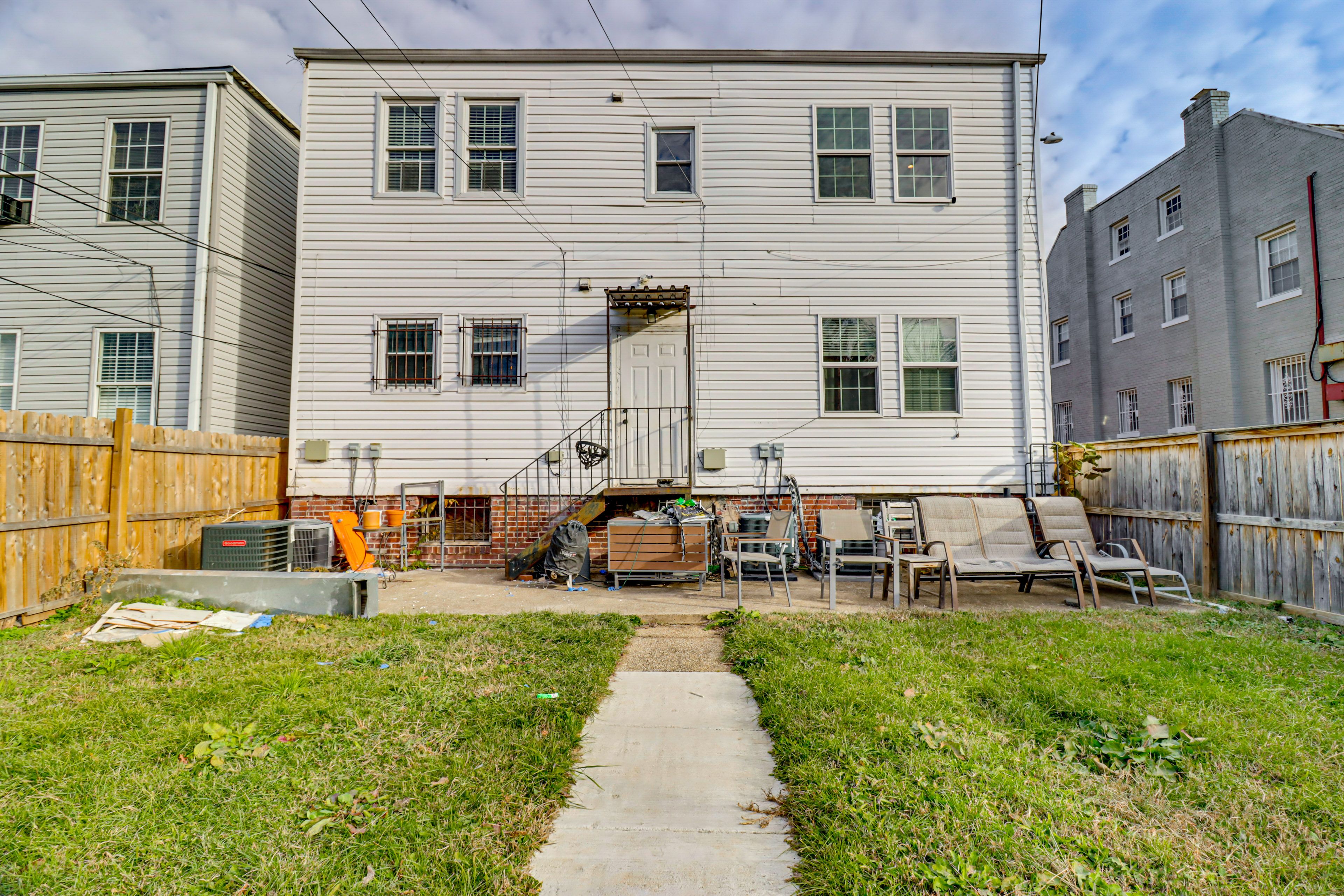 Apartment Exterior | Fenced Backyard