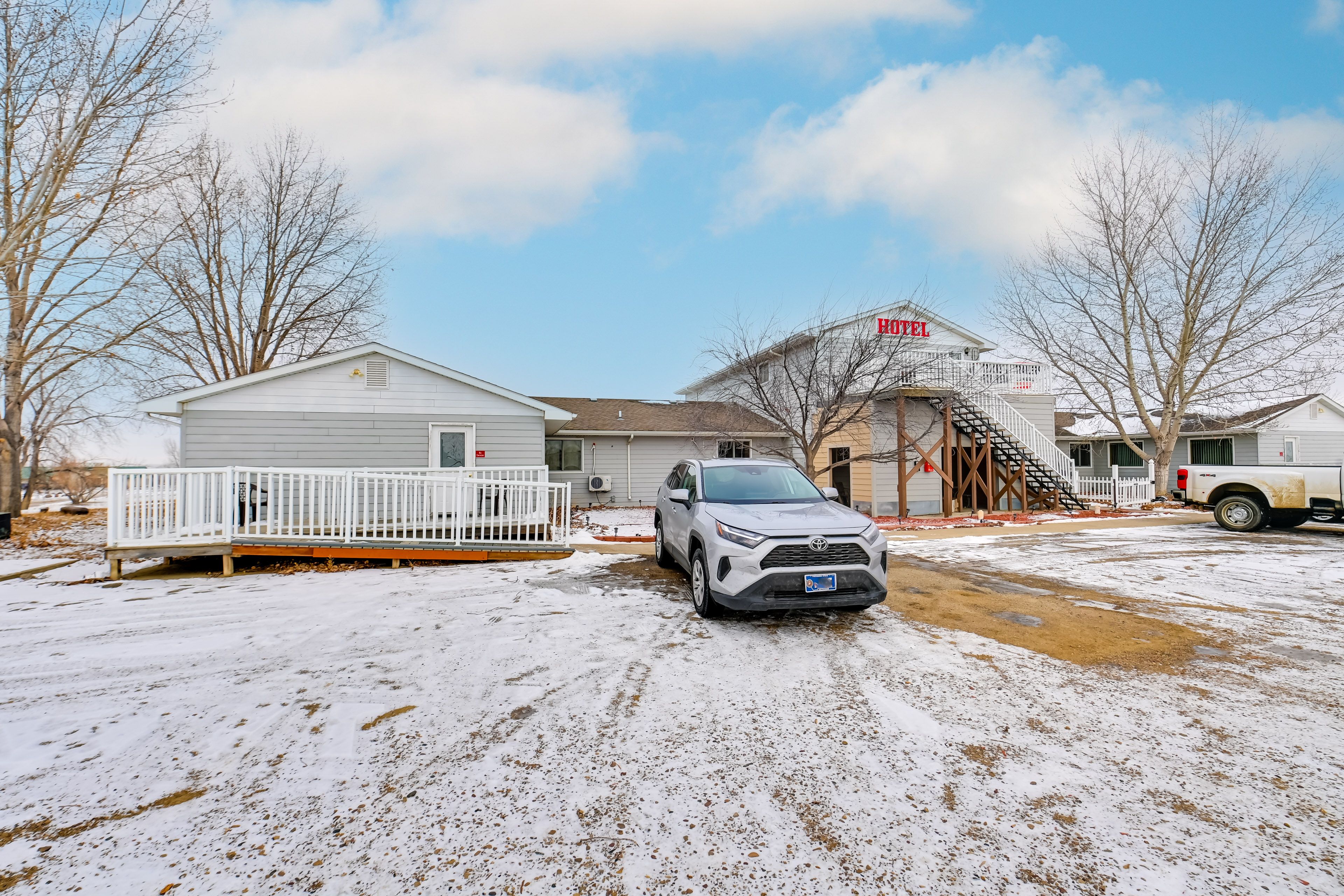 Property Exterior | Enclosed Community Patio | Gas Grill