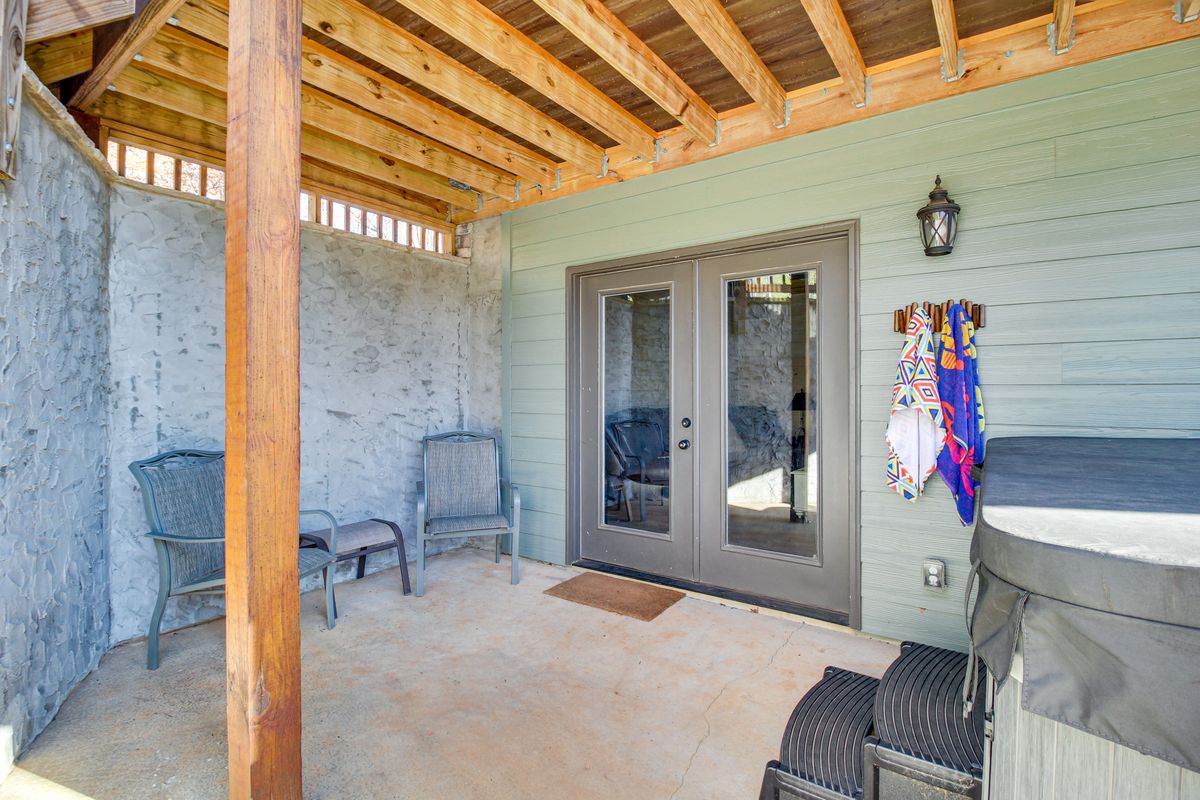 Covered patio with private hot tub