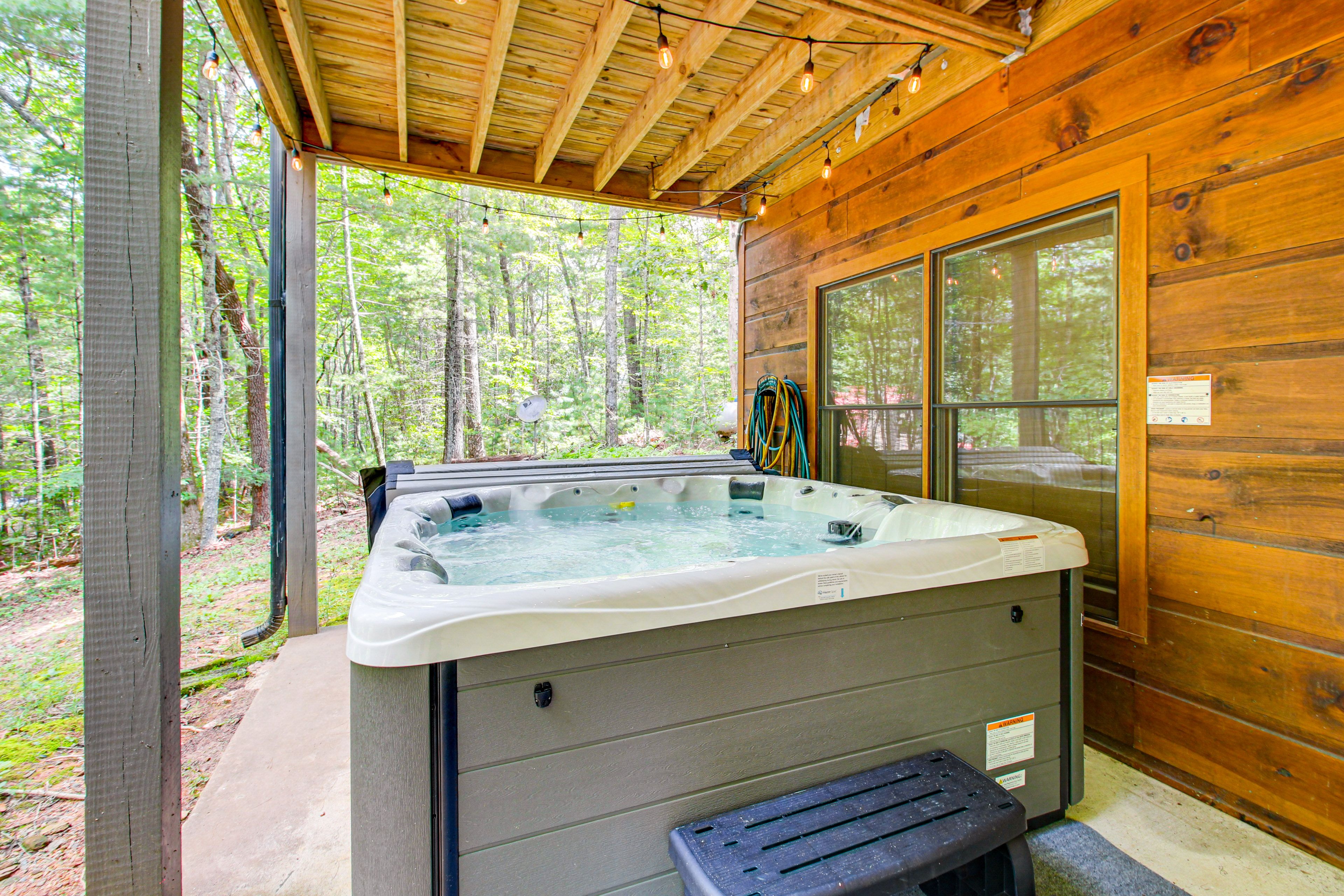 Covered Patio | Private Hot Tub | Wooded Surroundings