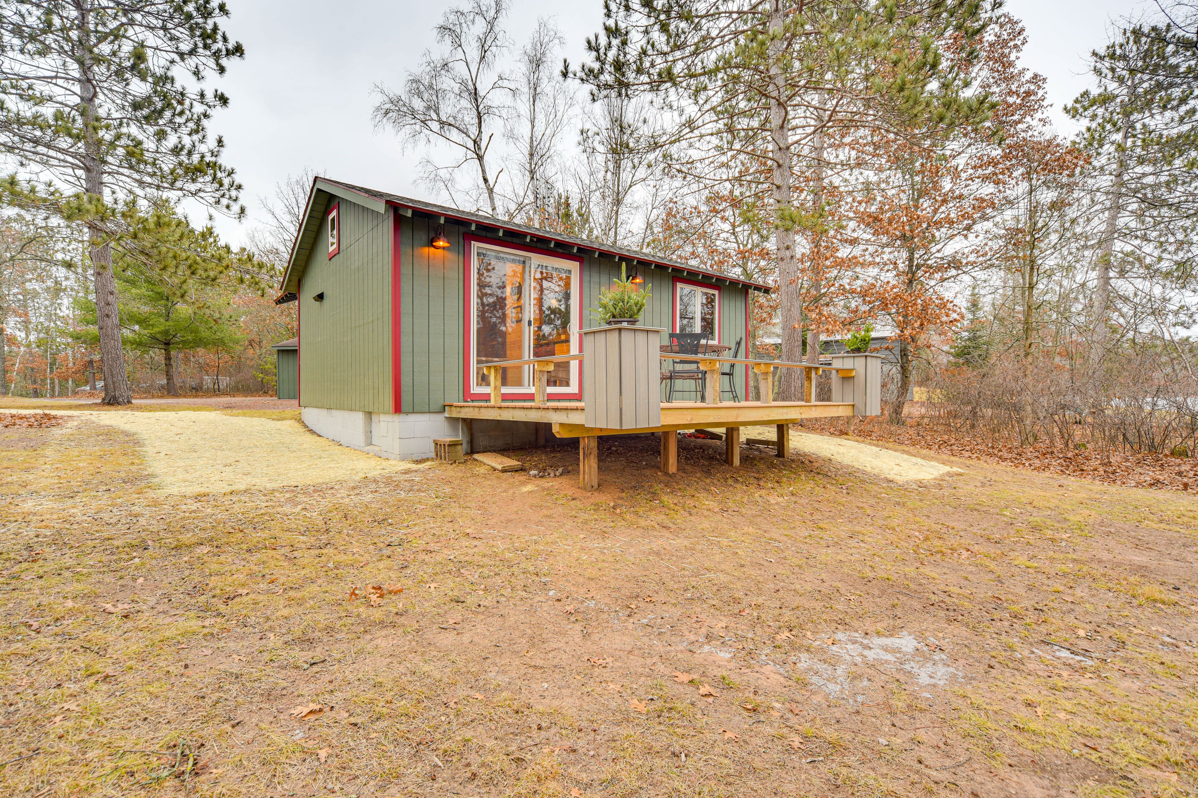 Cabin Exterior | Spacious Yard | Furnished Deck