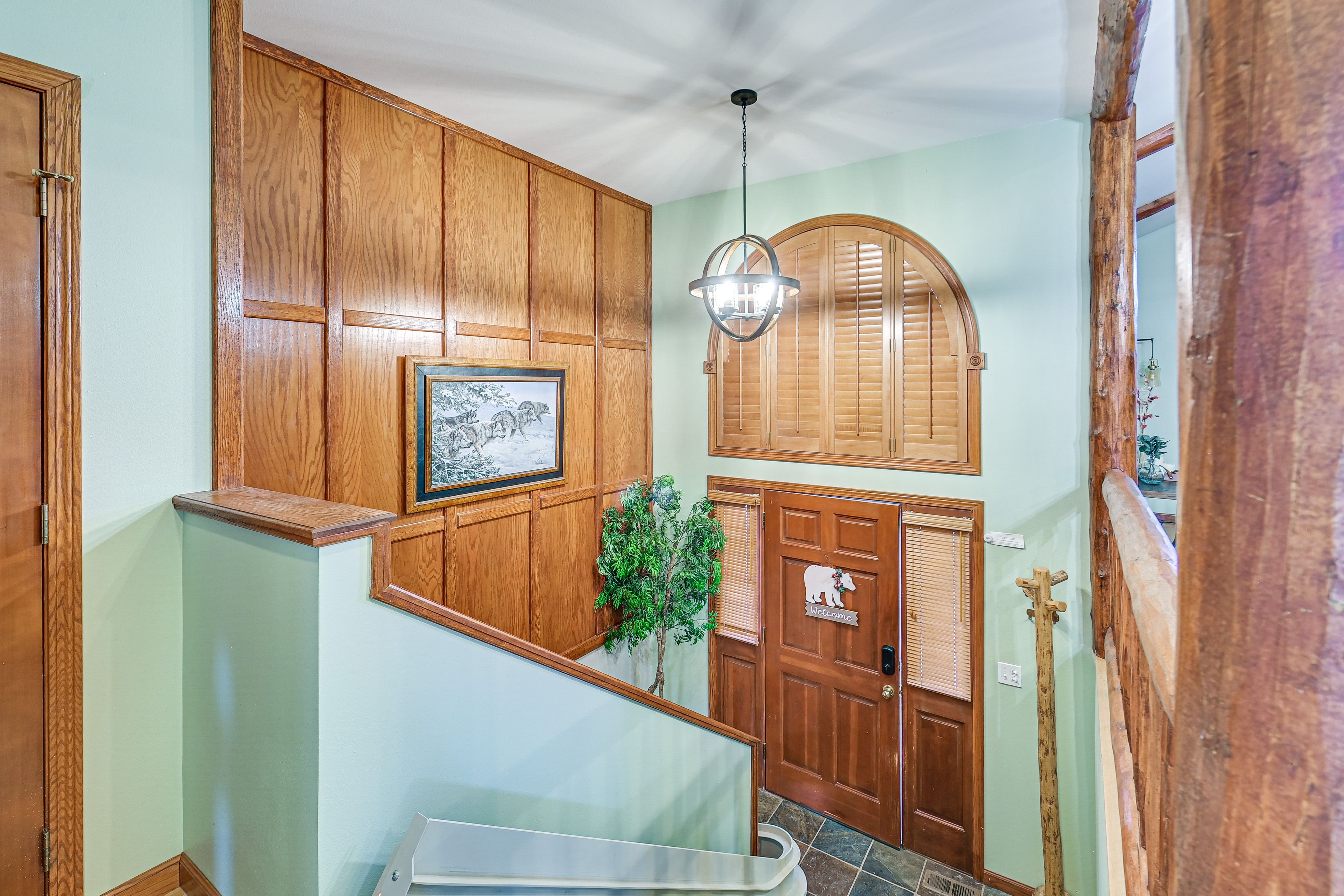 Staircase to Upper Level w/ Chair Lift