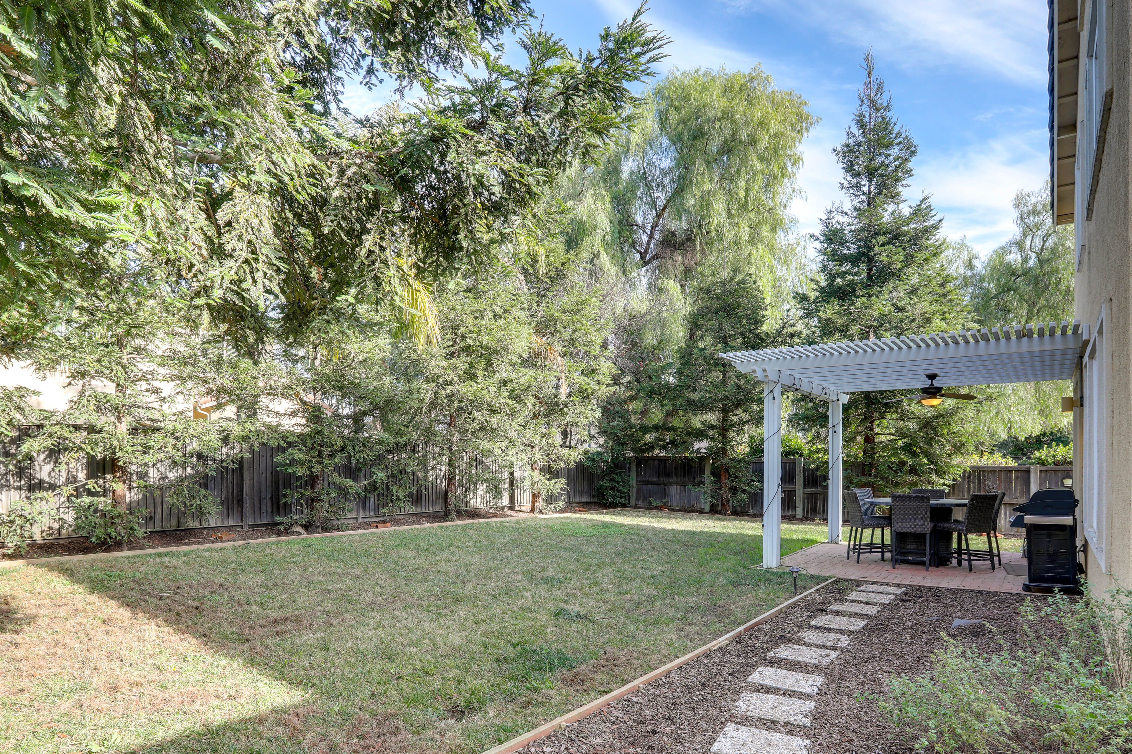 House Exterior | Fenced Backyard | Kids' Play Area