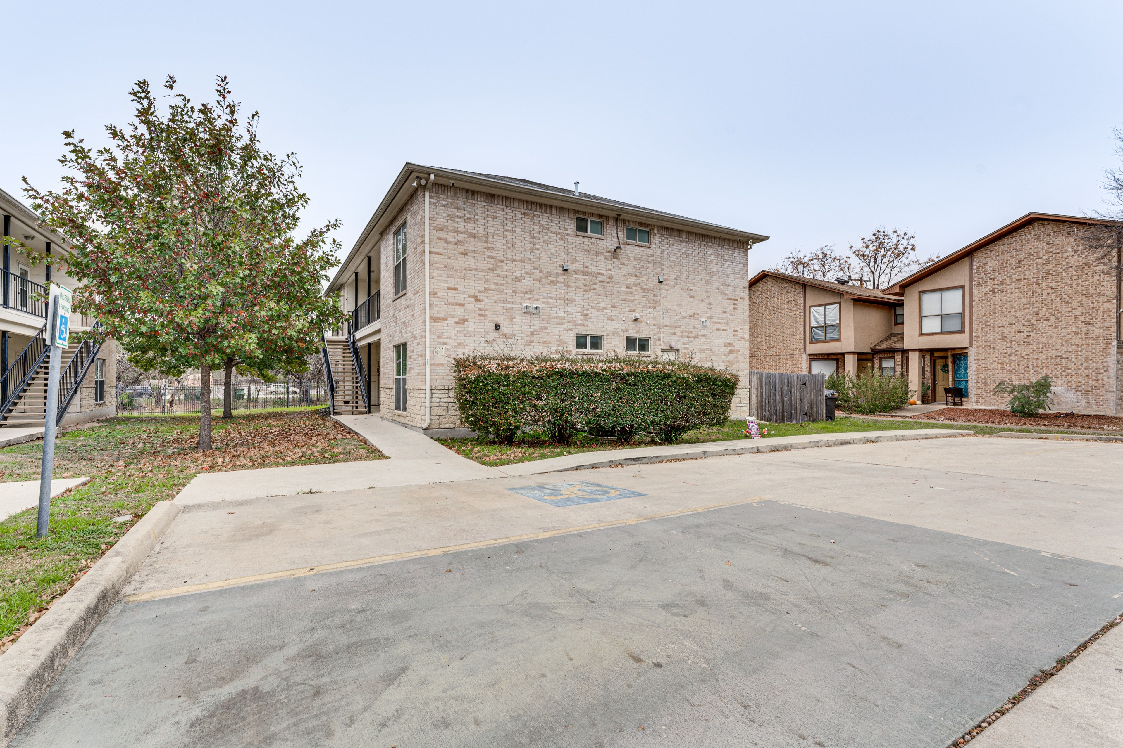 Apartment Building Exterior | Parking | Designated Spots (2 Vehicles)