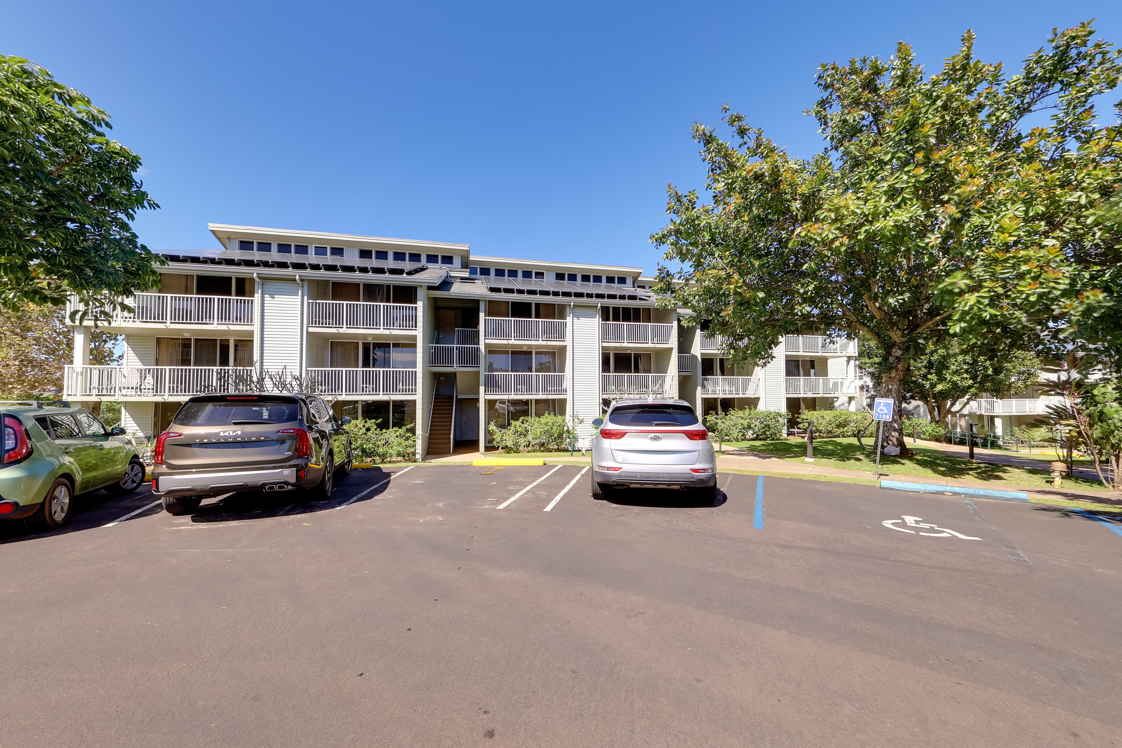 Property Exterior | Community Parking Lot ($15/Vehicle/Day)