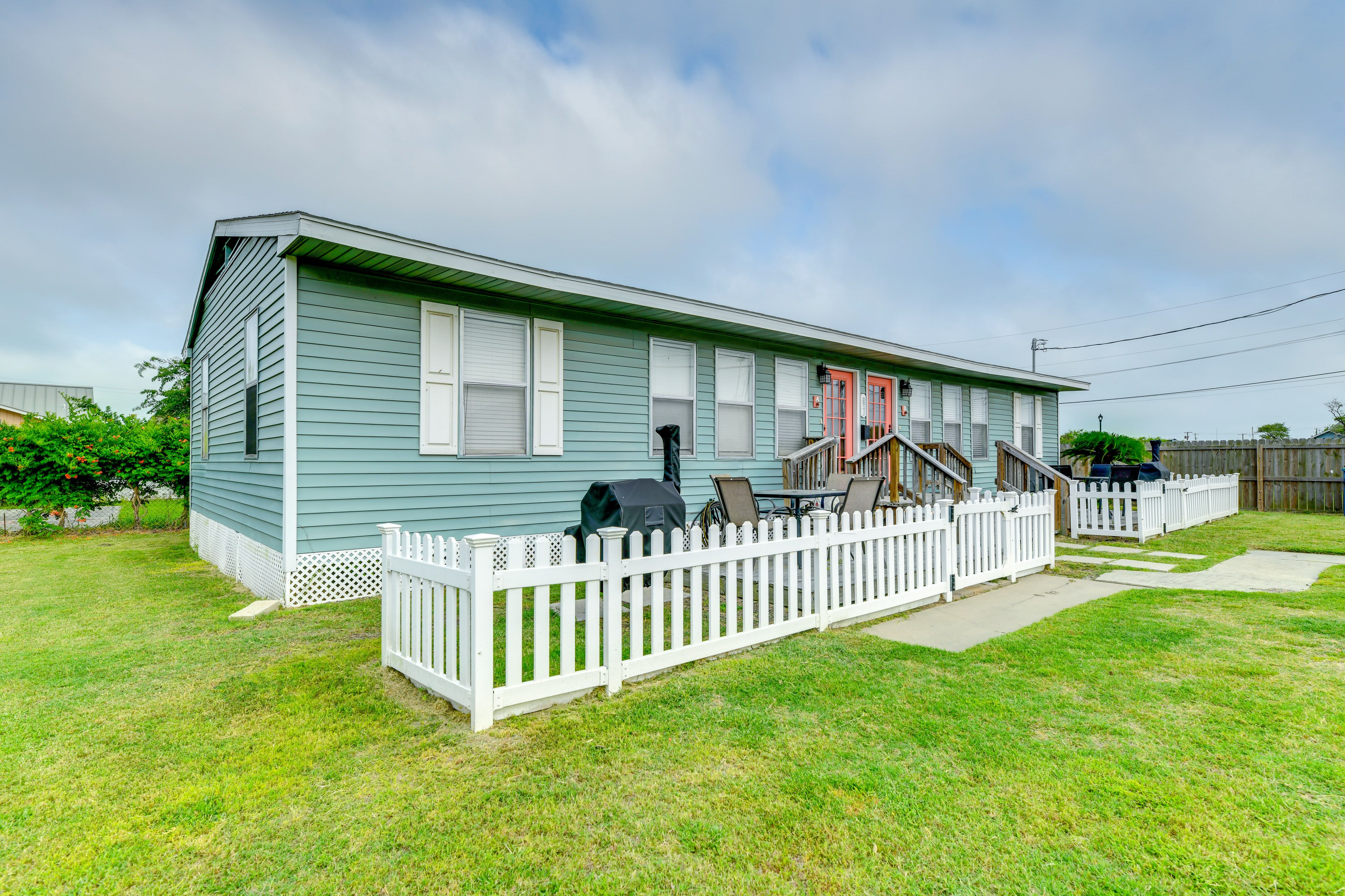 Partially Fenced-In Yard | Private Dining Area & Charcoal Grill