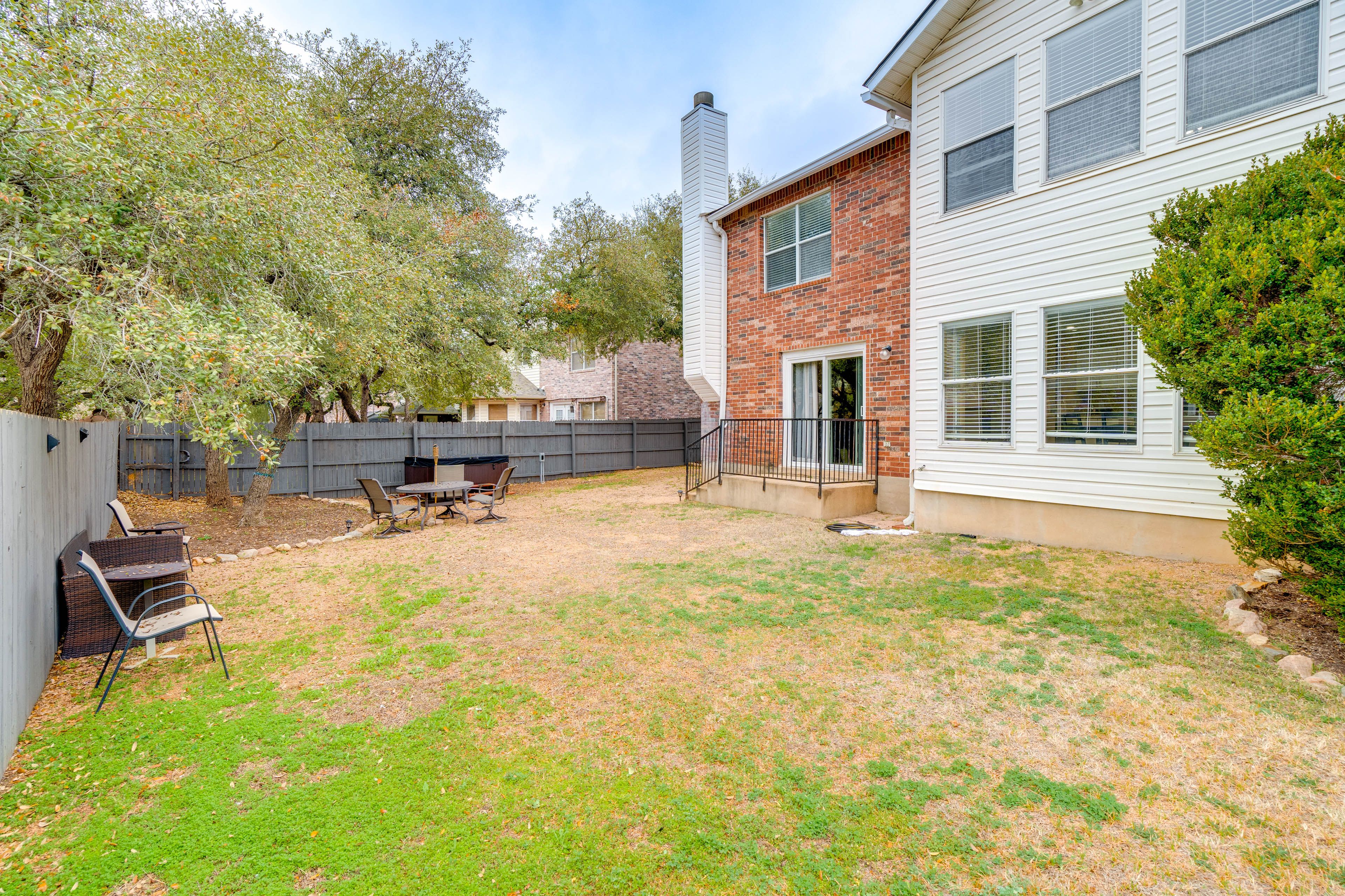 Fenced Yard | 7-Person Hot Tub | Gas Grill | Dining Area