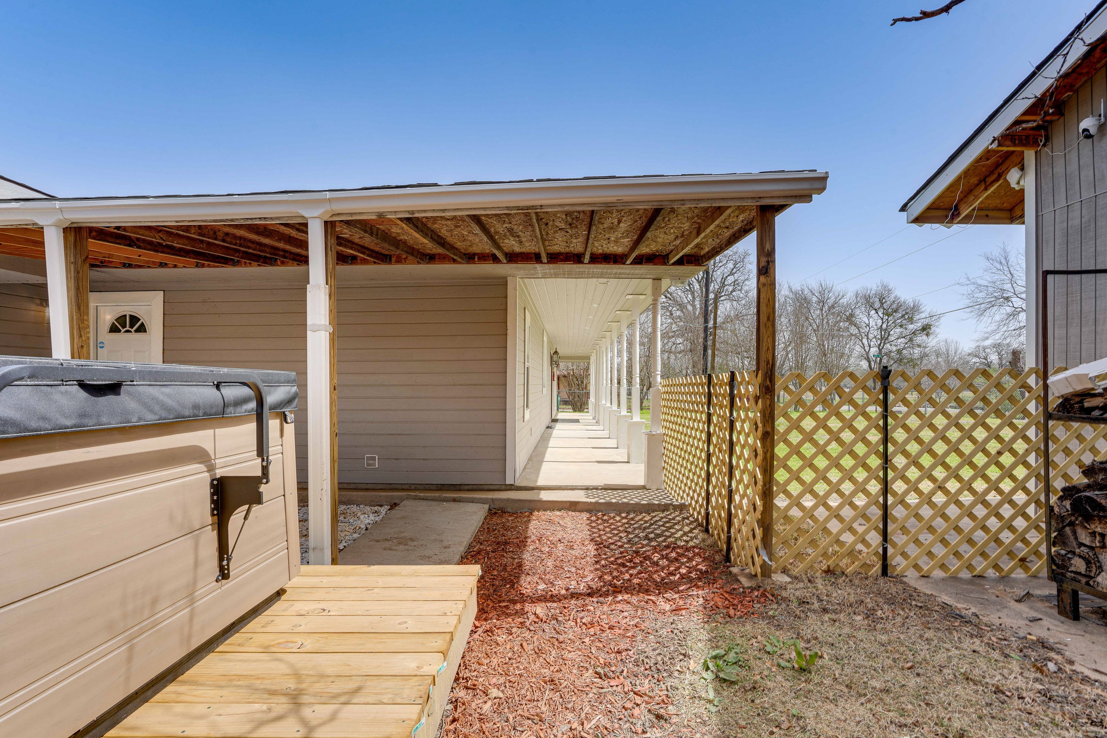 Property Exterior | Fenced-In Yard | Private Hot Tub