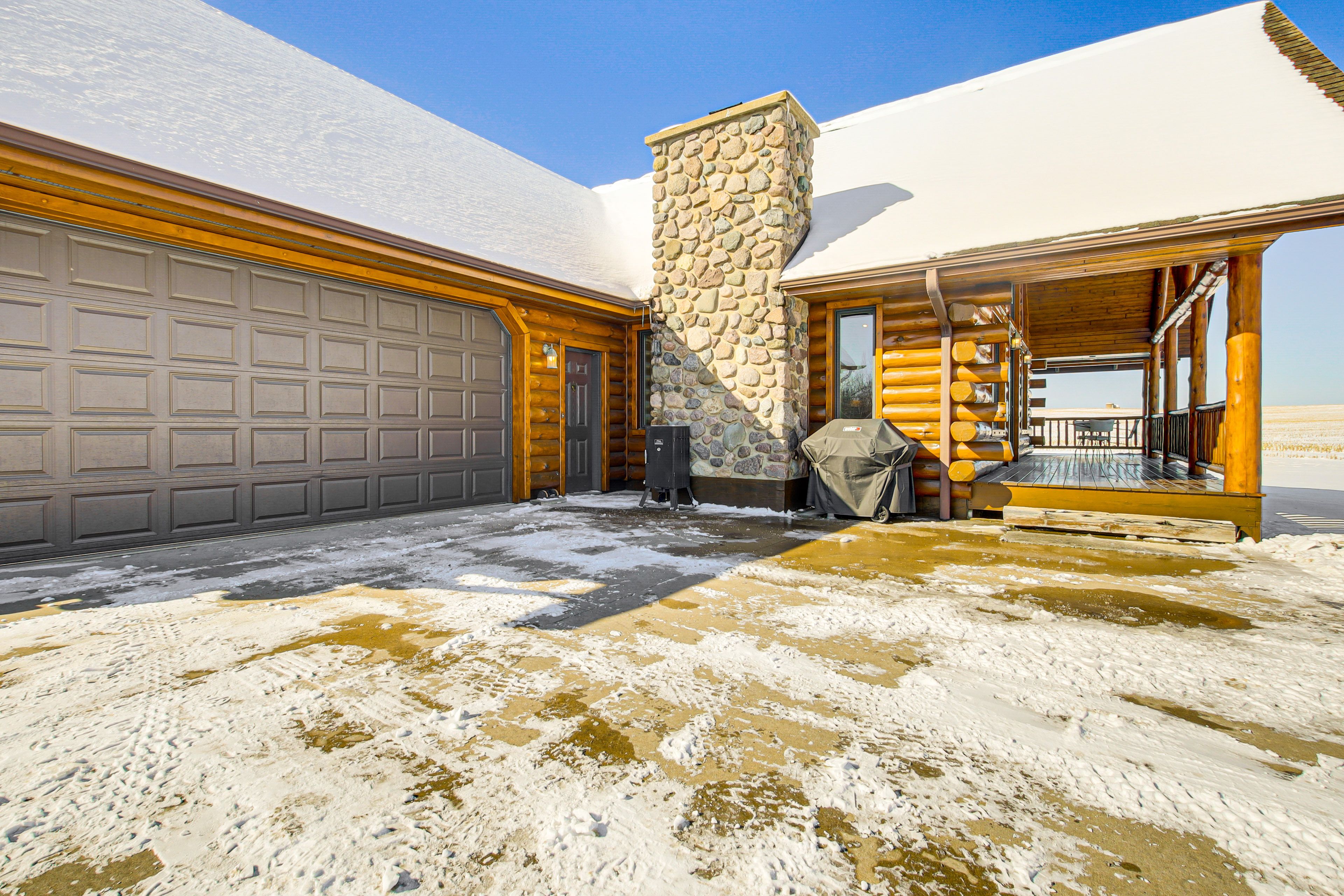 Cabin Exterior | Covered Deck w/ Dining Area | Gas Grill | Smoker