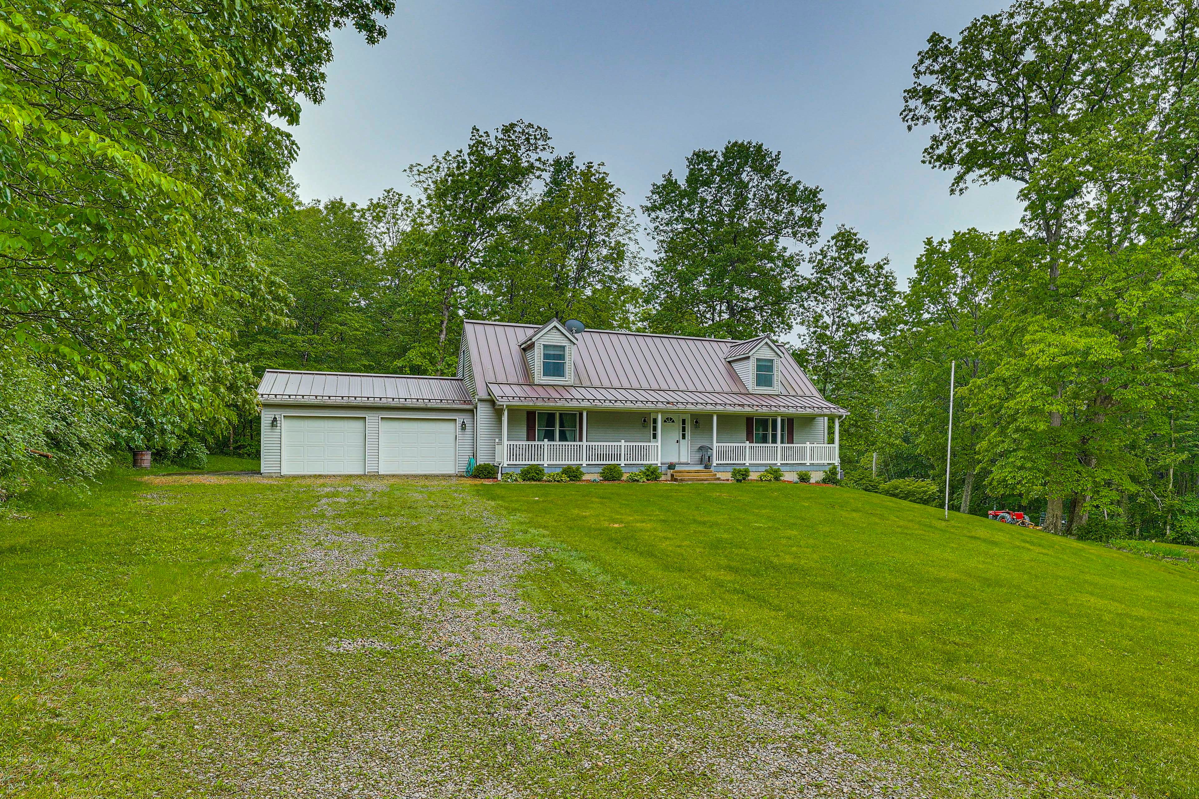 Exterior | Parking | Garage (2 Vehicles) | Ample Driveway Parking