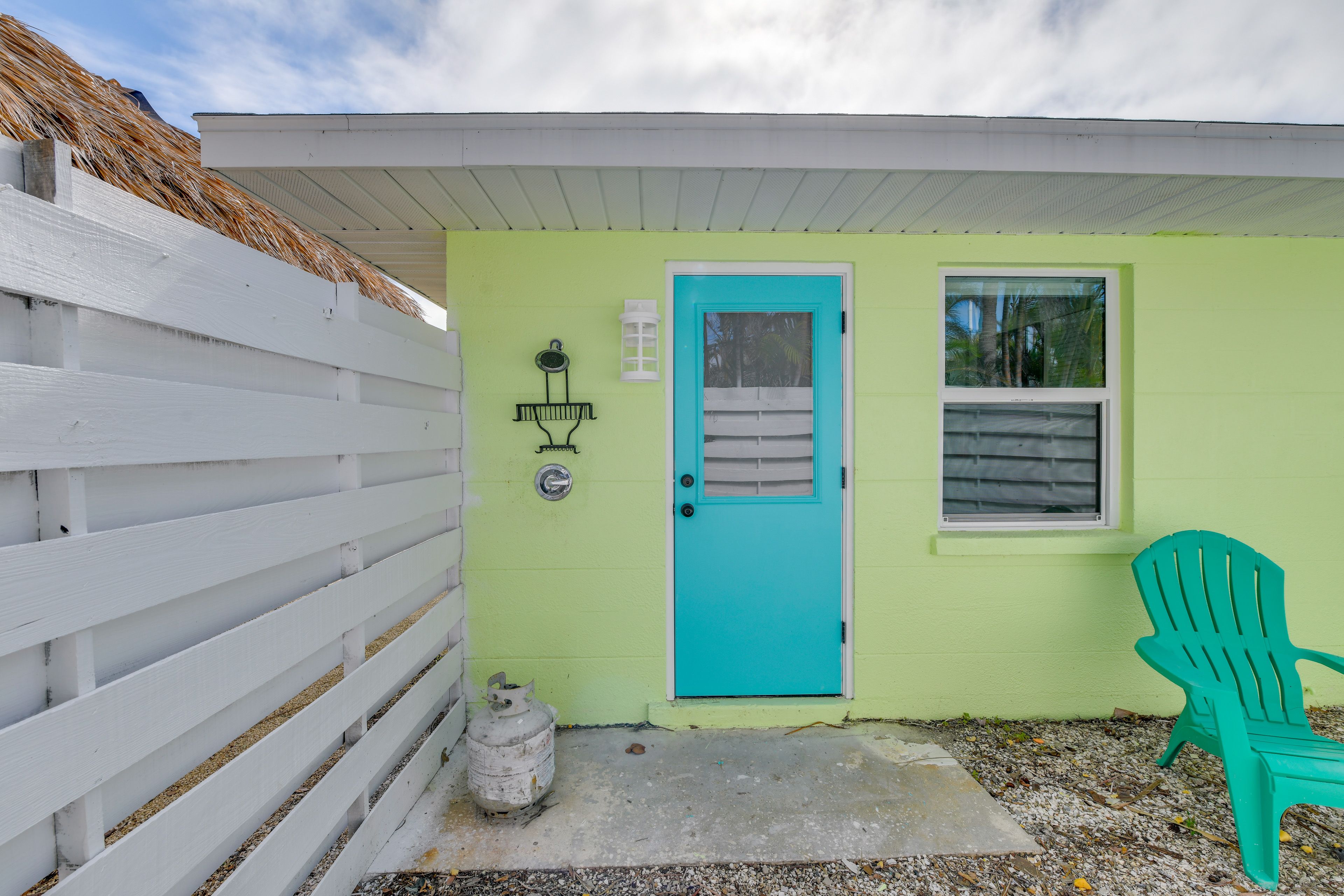 Partially Fenced-In Gravel Patio