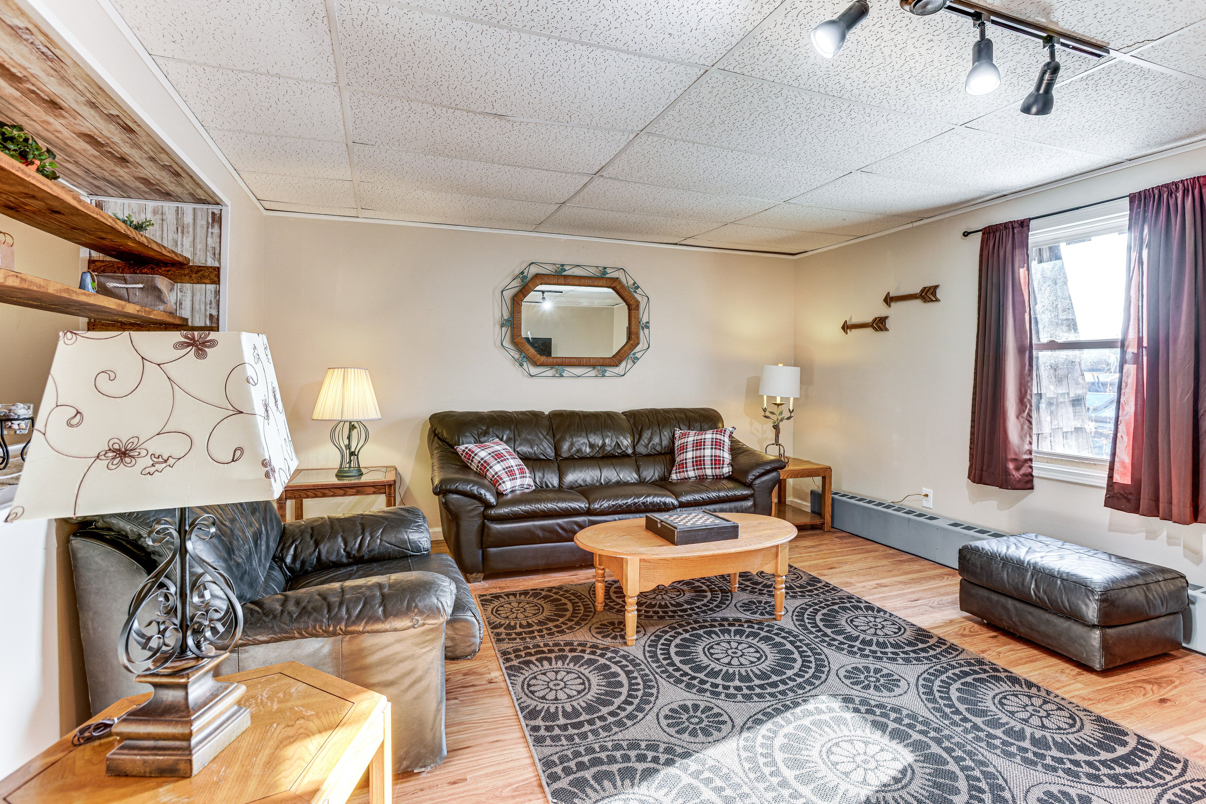 Living Room | Smart TV w/ Cable | Window A/C Unit | Radiator Heating