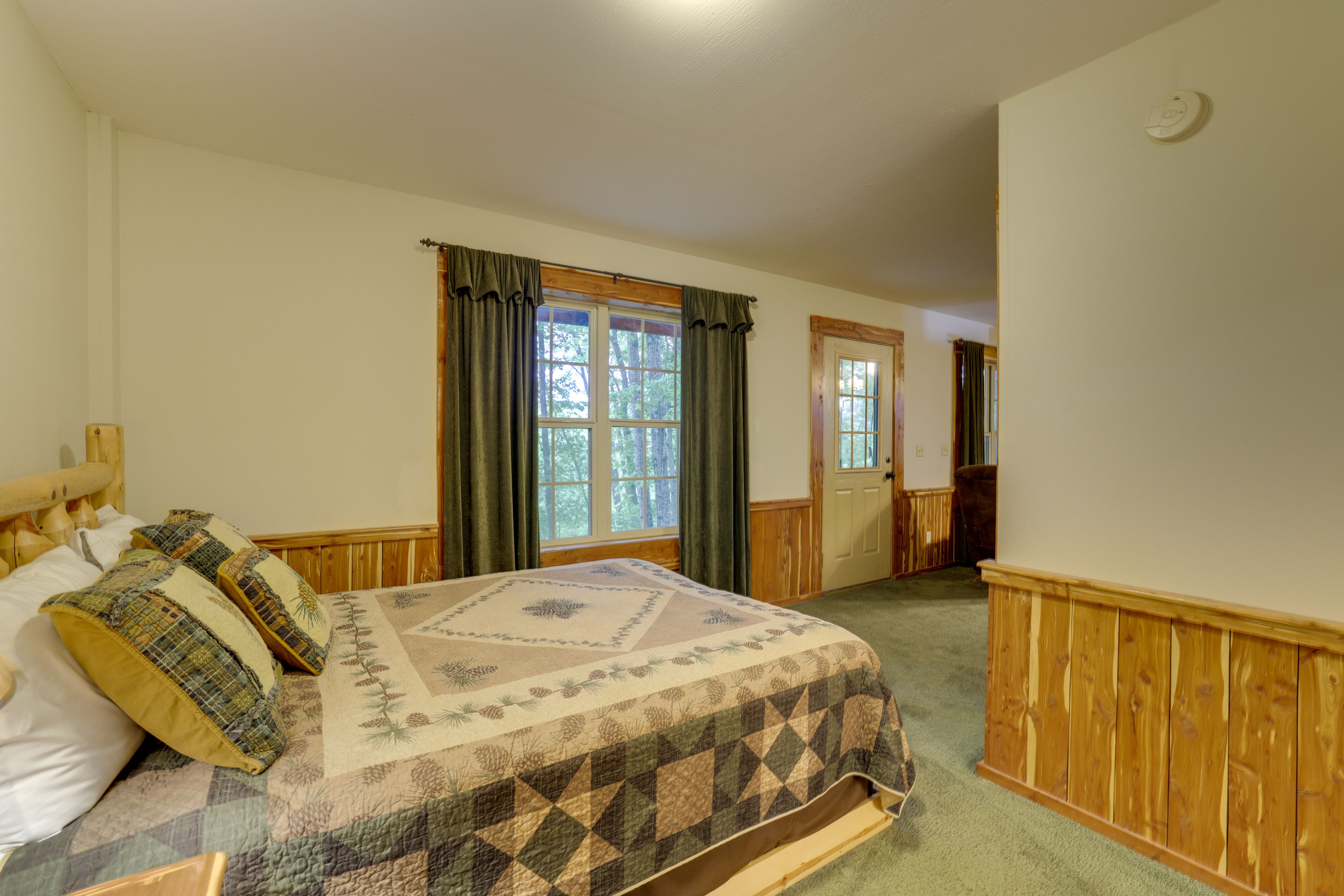Bedroom | 2 Queen Beds | Queen Sleeper Sofa | Separated By Door | Basement