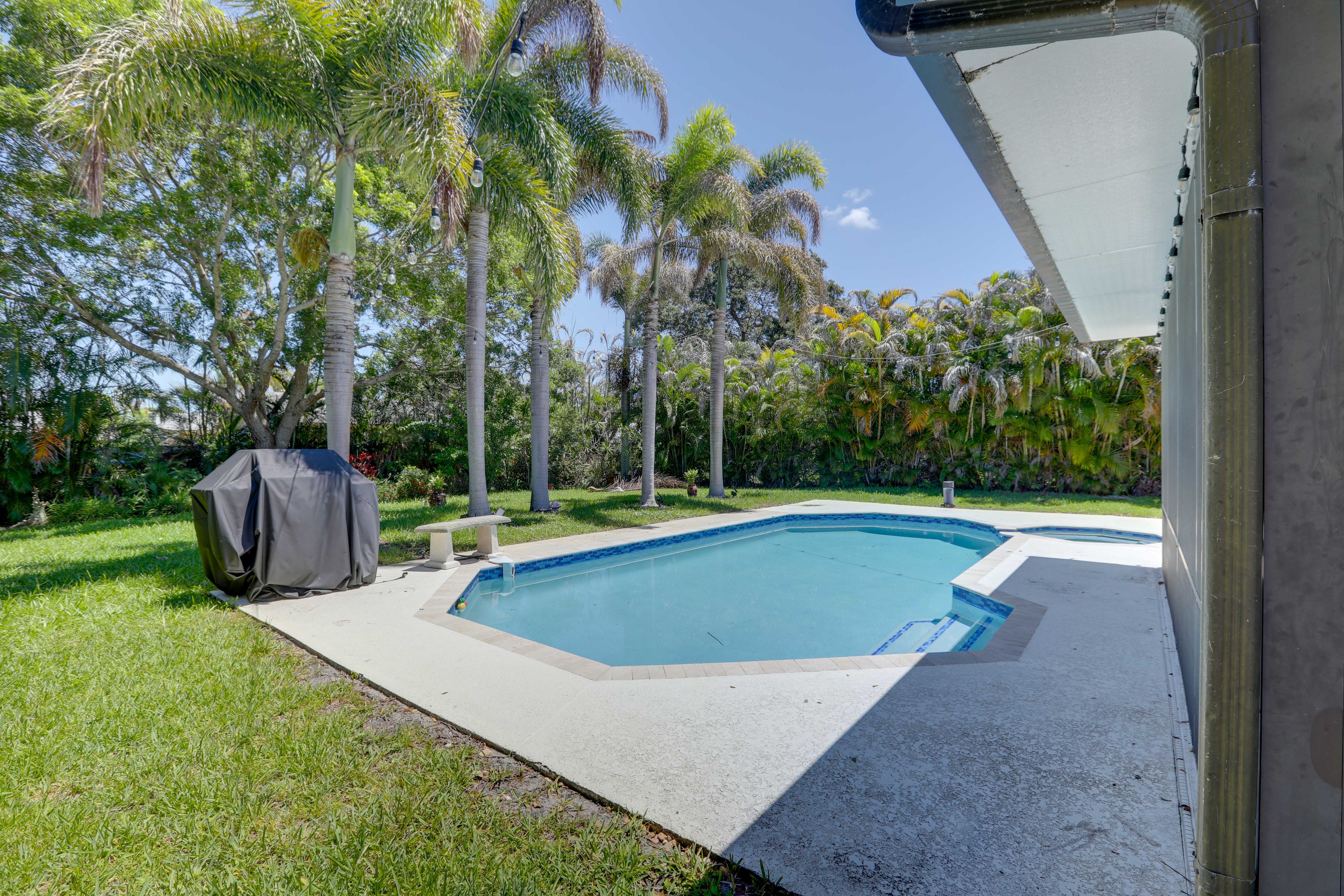Exterior | Fenced Backyard | Private Pool (Heated w/ Fee) | Hot Tub