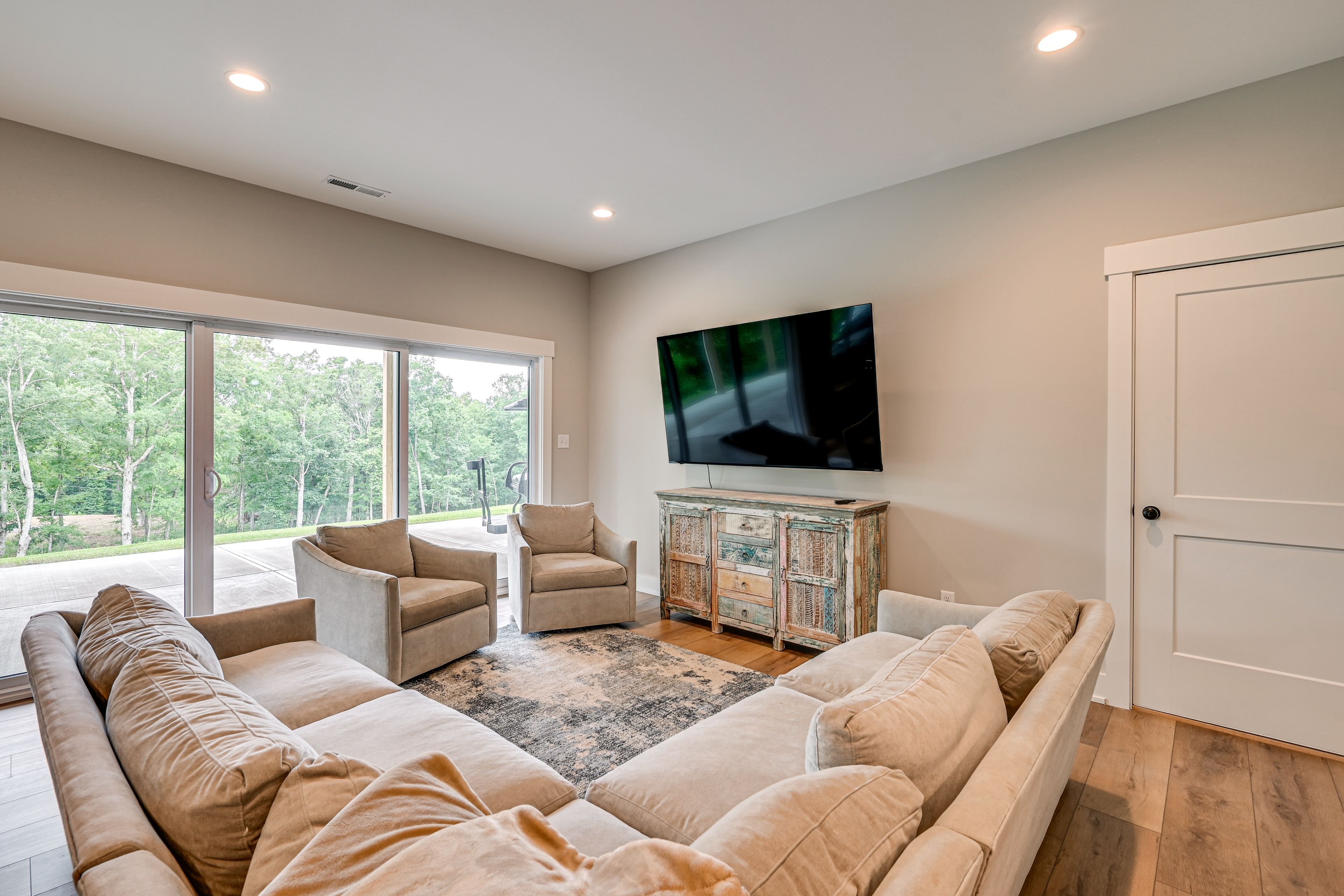Basement Living Area | 2 Queen Bunk Beds | Flat-Screen TV
