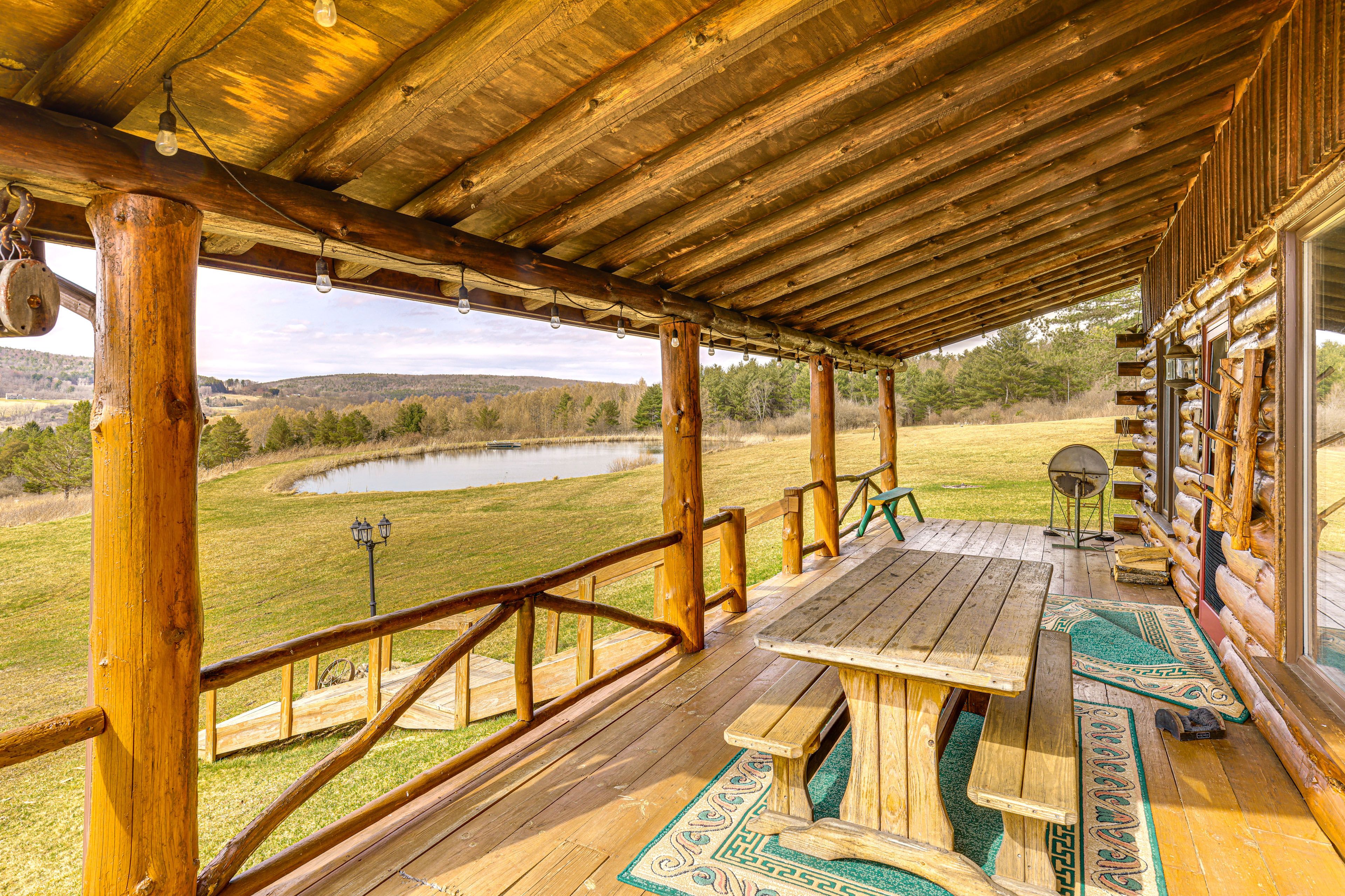 Cabin Exterior | Dining Area | Charcoal Grill/Smoker | Pond Views