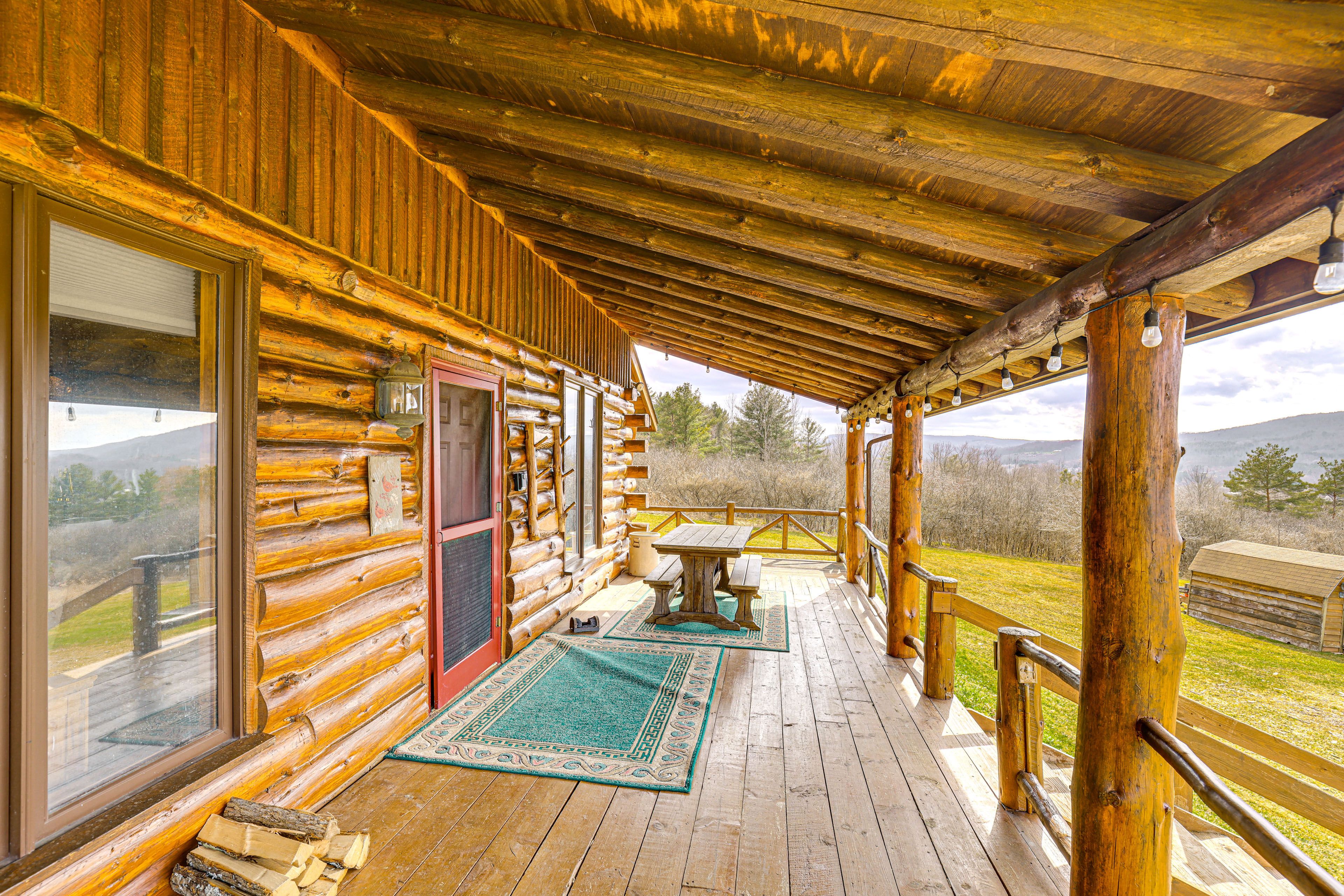 Cabin Exterior | Furnished Deck | Dining Area | Charcoal Grill/Smoker