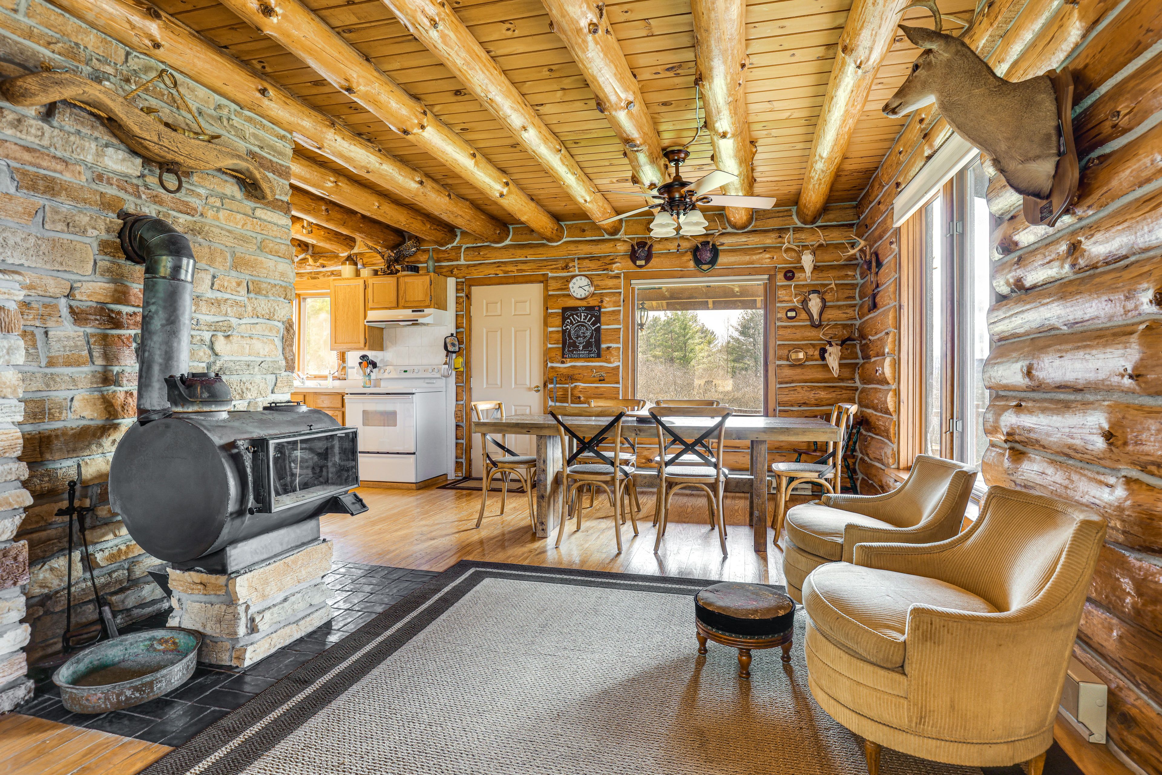 Living Area | Wood-Burning Stove | Dining Table | Dishware/Flatware